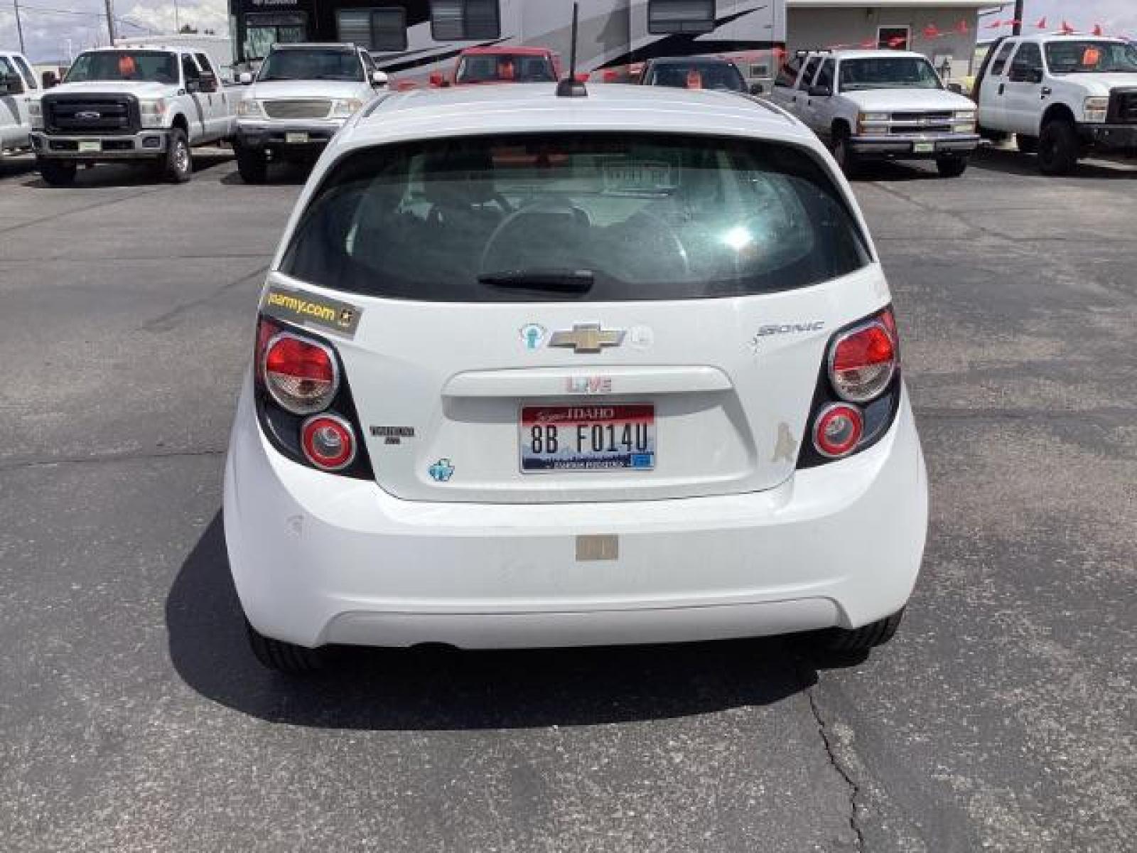 2016 Summit White Chevrolet Sonic LS Auto 5-Door (1G1JA6SH6G4) with an 1.8L L4 DOHC 24V engine, 6-Speed Automatic transmission, located at 1235 N Woodruff Ave., Idaho Falls, 83401, (208) 523-1053, 43.507172, -112.000488 - Photo #3