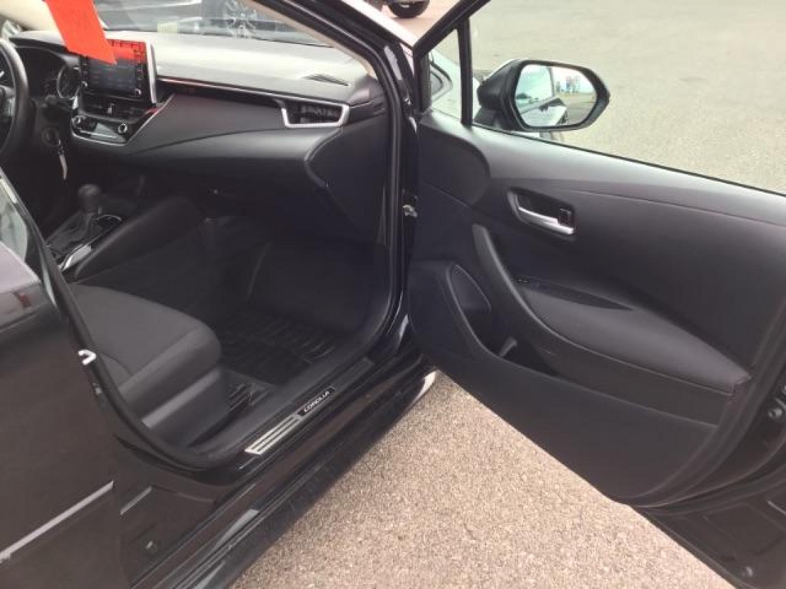 2021 BLACK /Black, cloth Toyota Corolla LE (5YFEPMAE1MP) with an 1.8L L4 DOHC 16V engine, Automatic transmission, located at 1235 N Woodruff Ave., Idaho Falls, 83401, (208) 523-1053, 43.507172, -112.000488 - This 2021 Toyota Corolla LE is in as good of shape as the day it rolled off the lot! Inside, outside, and mechanically it is in amazing condition! This one comes with a large touch screen display, rubber floor mats in the front, near new tires with 95% tread left, steering wheel mounted controls, la - Photo #19