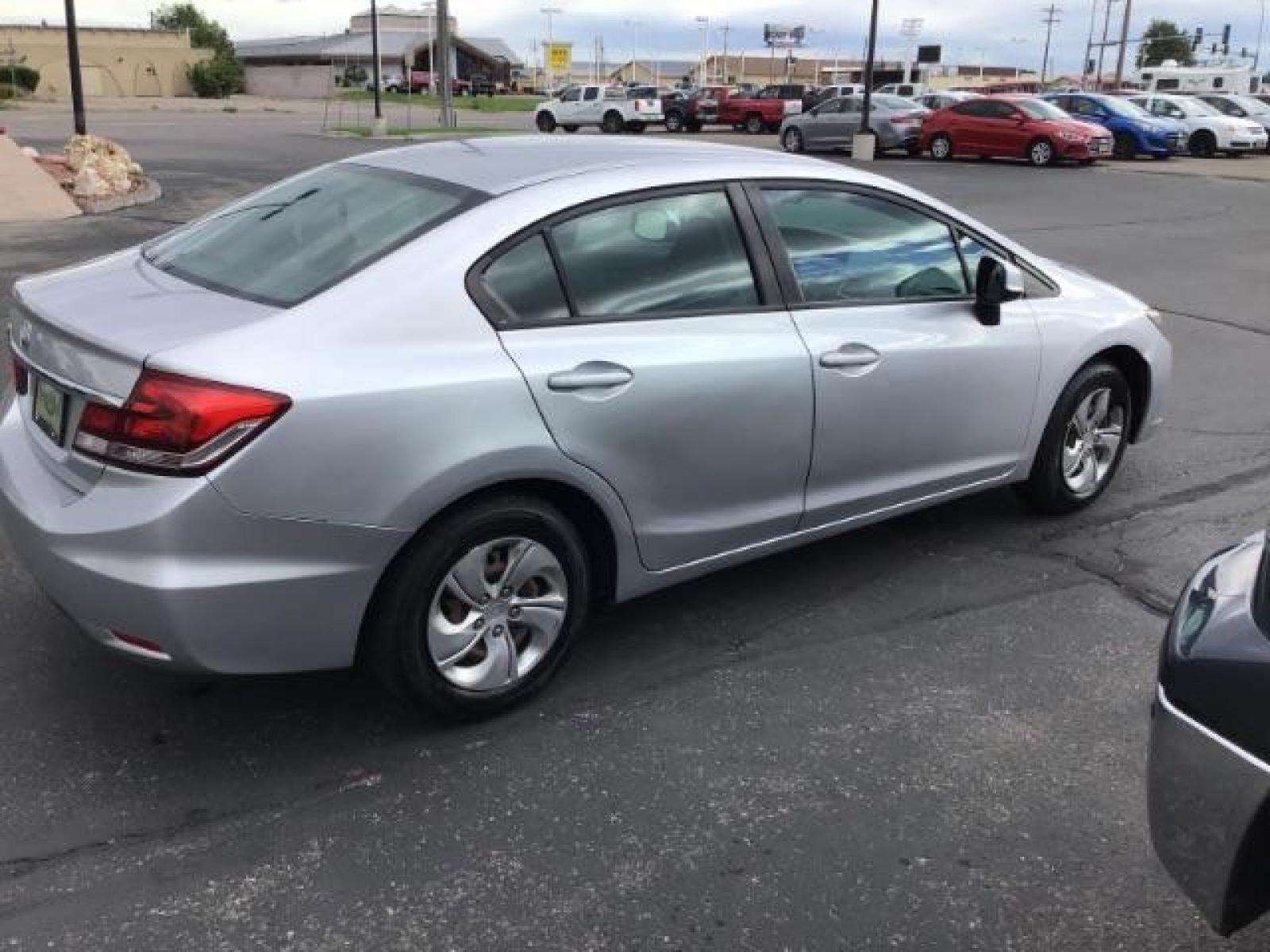 2013 Urban Titanium Metallic /Stone Cloth Interior Honda Civic LX Sedan 5-Speed AT (19XFB2F52DE) with an 1.8L L4 SOHC 16V engine, 5-Speed Automatic transmission, located at 1235 N Woodruff Ave., Idaho Falls, 83401, (208) 523-1053, 43.507172, -112.000488 - At Timberline Auto it is always easy to find a great deal on your next vehicle! Our experienced sales staff can help find the right vehicle will fit your needs. Our knowledgeable finance department has options for almost any credit score. We offer many warranty contract options to protect you new pr - Photo #5
