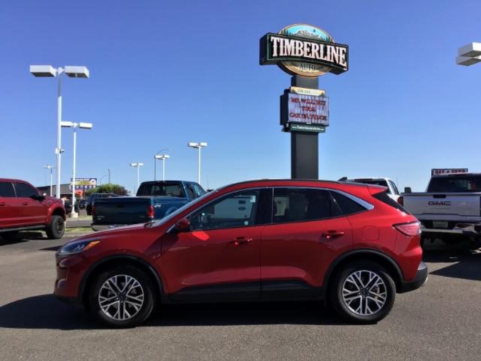 2021 Rapid Red Metallic Tinted Clearcoat /Ebony Ford Escape SEL AWD (1FMCU9H62MU) with an 1.5L L3 engine, 8-Speed Automatic transmission, located at 1235 N Woodruff Ave., Idaho Falls, 83401, (208) 523-1053, 43.507172, -112.000488 - 2021 Ford Escape SEL package with the 1.5L EcoBoost engine, heated seats, remote start, dual moonroof, and so much more! At Timberline Auto it is always easy to find a great deal on your next vehicle! Our experienced sales staff can help find the right vehicle that will fit your needs. Our knowled - Photo #2