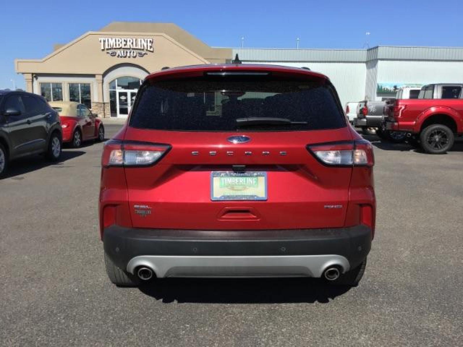 2021 Rapid Red Metallic Tinted Clearcoat /Ebony Ford Escape SEL AWD (1FMCU9H62MU) with an 1.5L L3 engine, 8-Speed Automatic transmission, located at 1235 N Woodruff Ave., Idaho Falls, 83401, (208) 523-1053, 43.507172, -112.000488 - 2021 Ford Escape SEL package with the 1.5L EcoBoost engine, heated seats, remote start, dual moonroof, and so much more! At Timberline Auto it is always easy to find a great deal on your next vehicle! Our experienced sales staff can help find the right vehicle that will fit your needs. Our knowled - Photo #4
