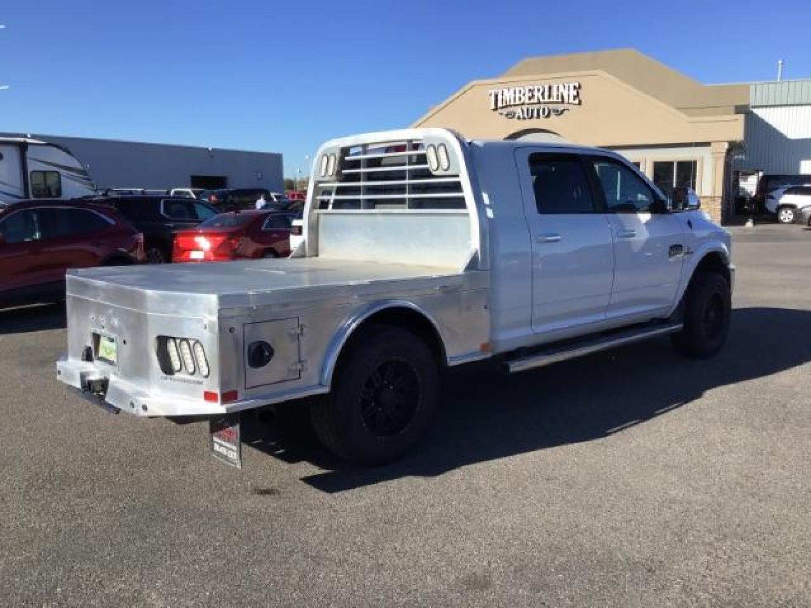 2015 Bright White Clear Coat /LEATHER RAM 2500 Longhorn Mega Cab SWB 4WD (3C6UR5PL9FG) with an 6.7L L6 OHV 24V TURBO DIESEL engine, 6-Speed Automatic transmission, located at 1235 N Woodruff Ave., Idaho Falls, 83401, (208) 523-1053, 43.507172, -112.000488 - This 2015 Ram 2500 Mega Cab Longhorn Edition, has the 6.7L Diesel motor. It has 159,423 miles. It comes with a flat bed, running boards, sunroof, heated and cooled seats, and rear heated seats. At Timberline Auto it is always easy to find a great deal on your next vehicle! Our experienced sales st - Photo #4