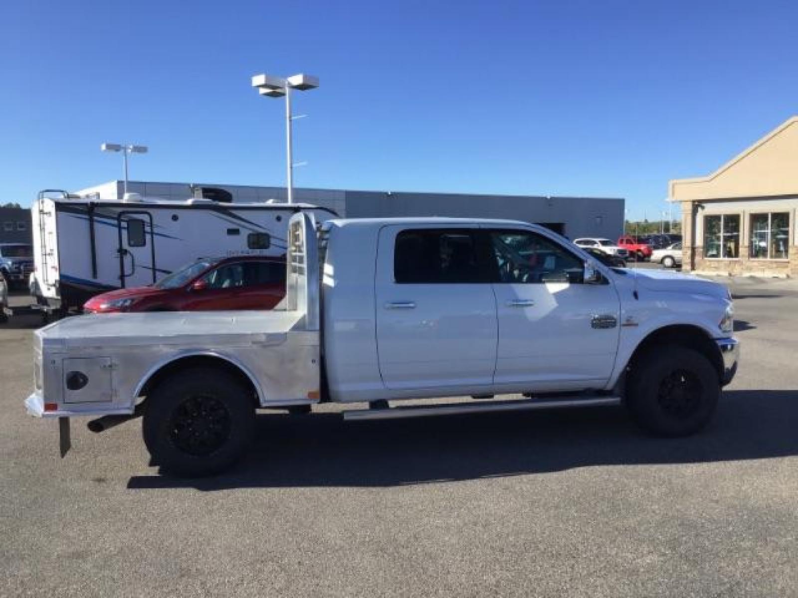 2015 Bright White Clear Coat /LEATHER RAM 2500 Longhorn Mega Cab SWB 4WD (3C6UR5PL9FG) with an 6.7L L6 OHV 24V TURBO DIESEL engine, 6-Speed Automatic transmission, located at 1235 N Woodruff Ave., Idaho Falls, 83401, (208) 523-1053, 43.507172, -112.000488 - This 2015 Ram 2500 Mega Cab Longhorn Edition, has the 6.7L Diesel motor. It has 159,423 miles. It comes with a flat bed, running boards, sunroof, heated and cooled seats, and rear heated seats. At Timberline Auto it is always easy to find a great deal on your next vehicle! Our experienced sales st - Photo #5