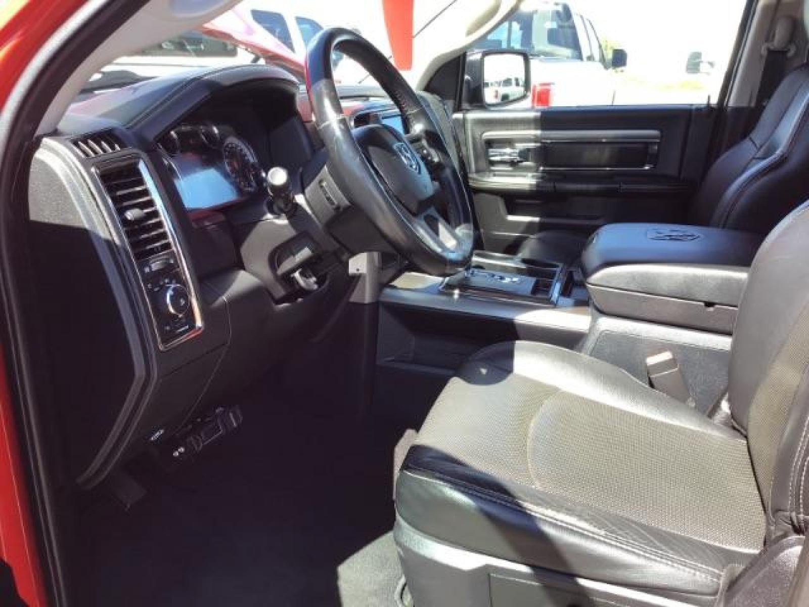 2013 Flame Red /Black Cloth Interior RAM 1500 Sport Quad Cab 4WD (1C6RR7HT4DS) with an 5.7L V8 OHV 16V engine, 6-Speed Automatic transmission, located at 1235 N Woodruff Ave., Idaho Falls, 83401, (208) 523-1053, 43.507172, -112.000488 - Leather, sport package, 4X4, Bluetooth, Alpine Sound System, heated and cooled seats, heated steering wheel, tow package, 6.6' bed, Tonneau cover. At Timberline Auto it is always easy to find a great deal on your next vehicle! Our experienced sales staff can help find the right vehicle that will fi - Photo #13