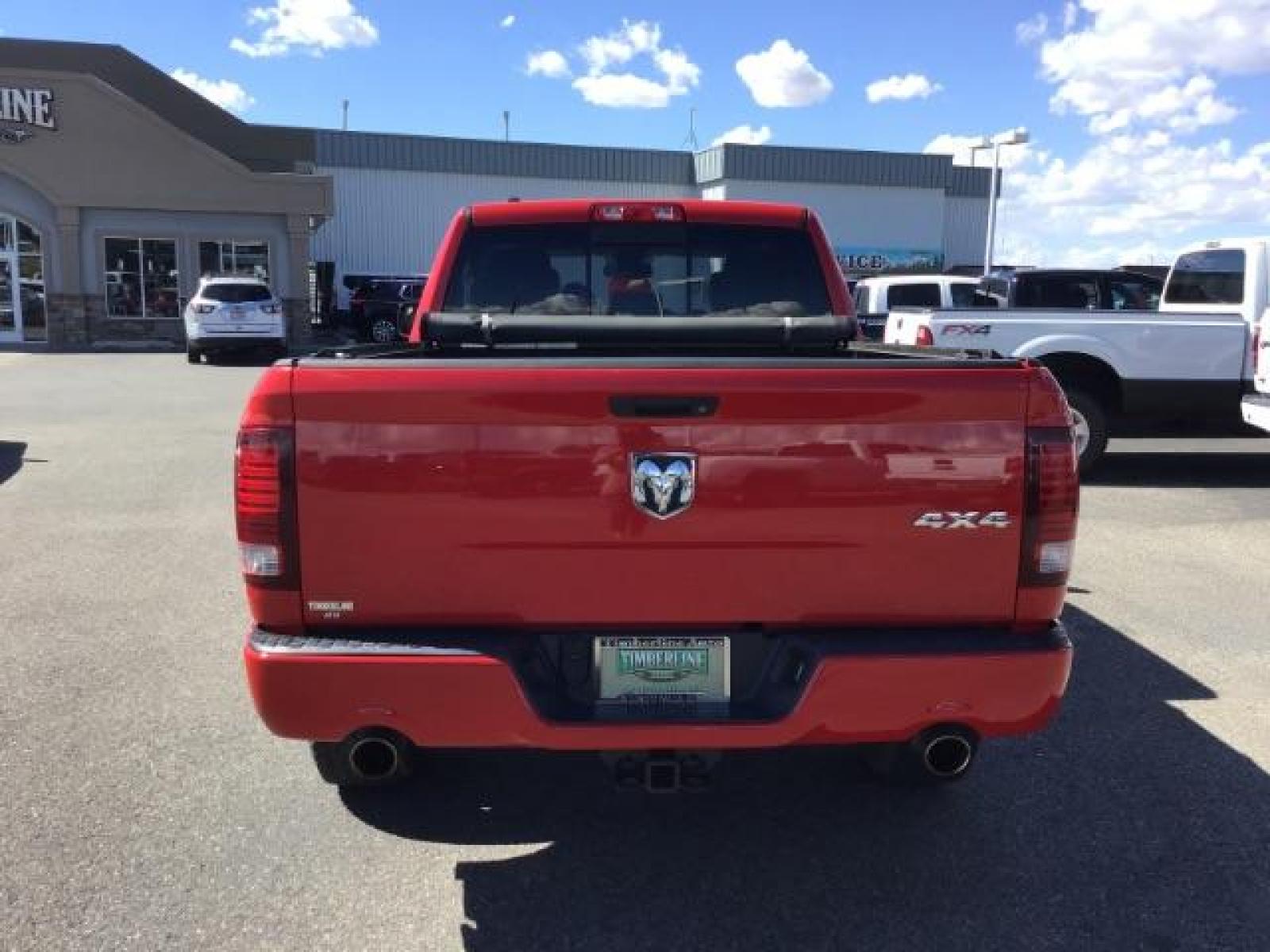 2013 Flame Red /Black Cloth Interior RAM 1500 Sport Quad Cab 4WD (1C6RR7HT4DS) with an 5.7L V8 OHV 16V engine, 6-Speed Automatic transmission, located at 1235 N Woodruff Ave., Idaho Falls, 83401, (208) 523-1053, 43.507172, -112.000488 - Leather, sport package, 4X4, Bluetooth, Alpine Sound System, heated and cooled seats, heated steering wheel, tow package, 6.6' bed, Tonneau cover. At Timberline Auto it is always easy to find a great deal on your next vehicle! Our experienced sales staff can help find the right vehicle that will fi - Photo #3