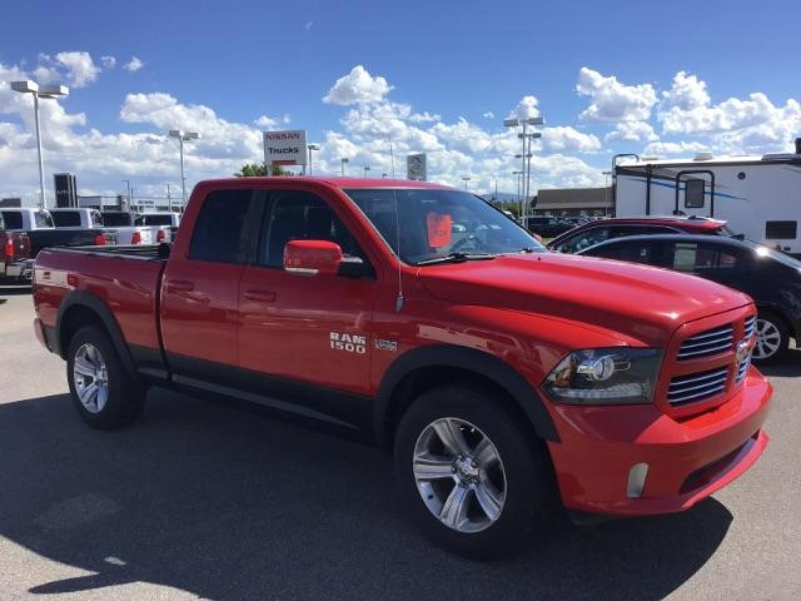 2013 Flame Red /Black Cloth Interior RAM 1500 Sport Quad Cab 4WD (1C6RR7HT4DS) with an 5.7L V8 OHV 16V engine, 6-Speed Automatic transmission, located at 1235 N Woodruff Ave., Idaho Falls, 83401, (208) 523-1053, 43.507172, -112.000488 - Leather, sport package, 4X4, Bluetooth, Alpine Sound System, heated and cooled seats, heated steering wheel, tow package, 6.6' bed, Tonneau cover. At Timberline Auto it is always easy to find a great deal on your next vehicle! Our experienced sales staff can help find the right vehicle that will fi - Photo #6