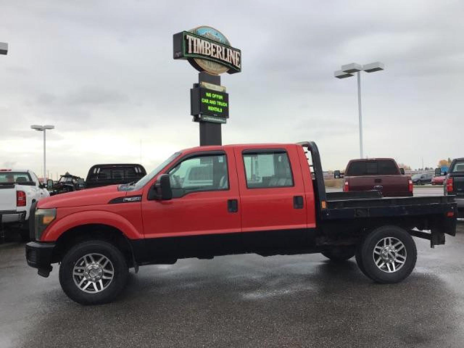 2013 Vermillion Red /Steel Vinyl Interior Ford F-350 SD XL Crew Cab 4WD (1FT8W3B60DE) with an 6.2L V8 OHV 16V engine, 6-Speed Automatic transmission, located at 1235 N Woodruff Ave., Idaho Falls, 83401, (208) 523-1053, 43.507172, -112.000488 - This 2013 Ford F350 XL. Has the 6.2L V8 motor. It only has 99,446 miles. It has the Flat bed, and plenty of room to haul people around. At Timberline Auto it is always easy to find a great deal on your next vehicle! Our experienced sales staff can help find the right vehicle that will fit your needs - Photo #1