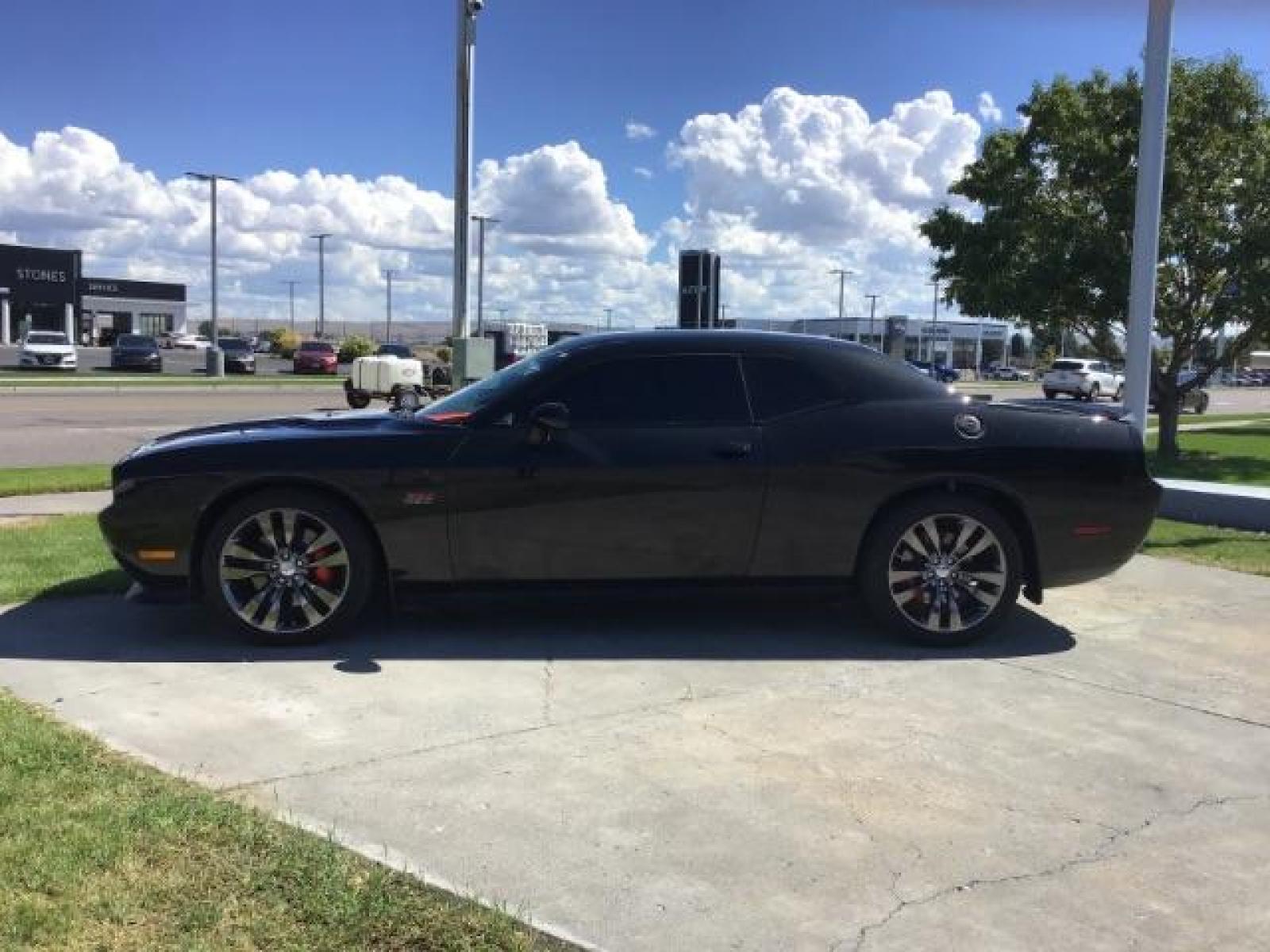 2014 Black Clearcoat /Radar Red/Dk Slate Gray Dodge Challenger SRT8 (2C3CDYCJ5EH) with an 6.4L V8 OHV 16V engine, 5-Speed Automatic transmission, located at 1235 N Woodruff Ave., Idaho Falls, 83401, (208) 523-1053, 43.507172, -112.000488 - SRT8, 392 Hemi, leather, automatic transmission,, heated seats, sunroof, multiple charge and USB ports, navigation, heated steering wheel, park assist, very low miles. At Timberline Auto it is always easy to find a great deal on your next vehicle! Our experienced sales staff can help find the right - Photo #1