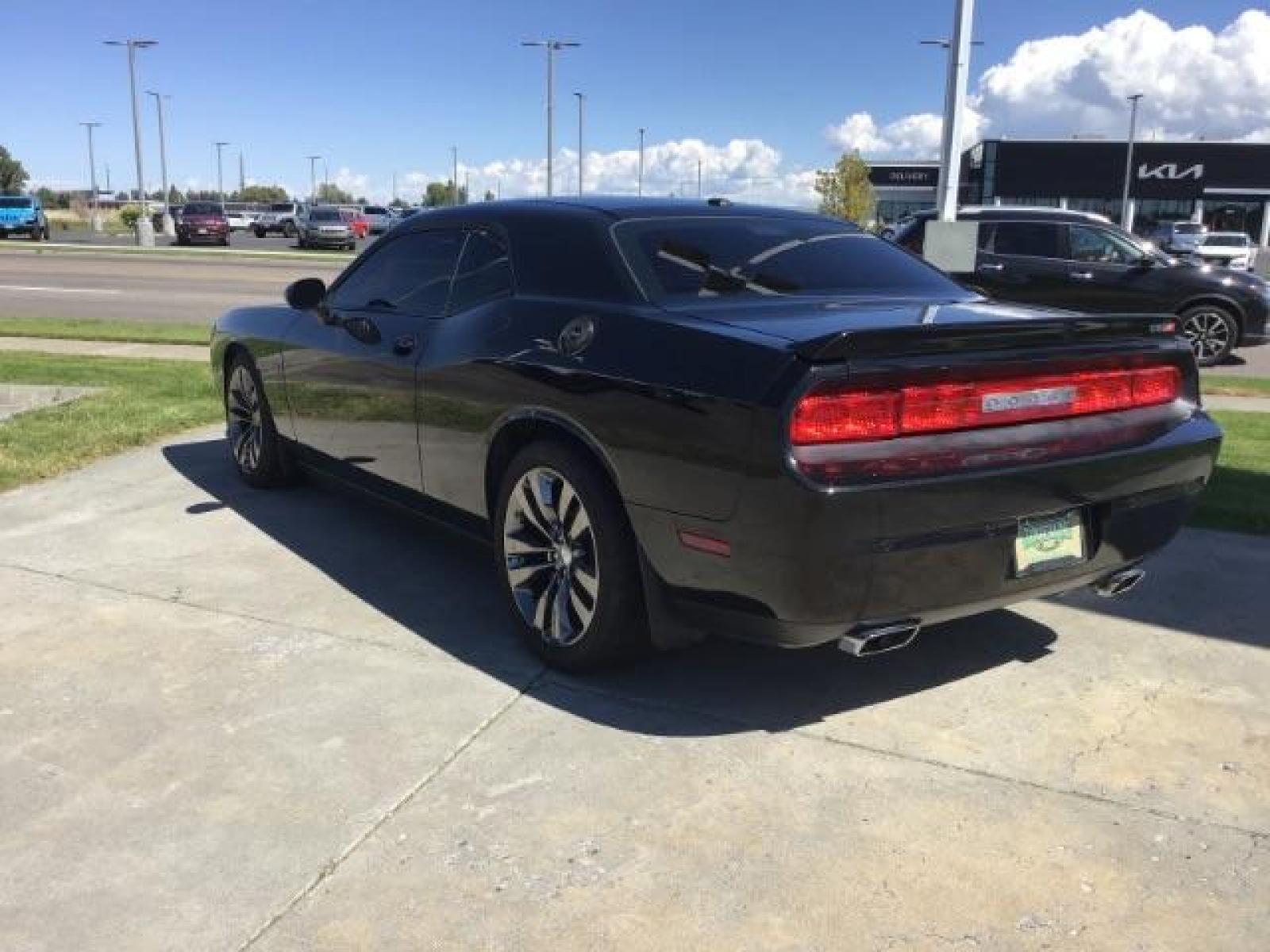 2014 Black Clearcoat /Radar Red/Dk Slate Gray Dodge Challenger SRT8 (2C3CDYCJ5EH) with an 6.4L V8 OHV 16V engine, 5-Speed Automatic transmission, located at 1235 N Woodruff Ave., Idaho Falls, 83401, (208) 523-1053, 43.507172, -112.000488 - SRT8, 392 Hemi, leather, automatic transmission,, heated seats, sunroof, multiple charge and USB ports, navigation, heated steering wheel, park assist, very low miles. At Timberline Auto it is always easy to find a great deal on your next vehicle! Our experienced sales staff can help find the right - Photo #2