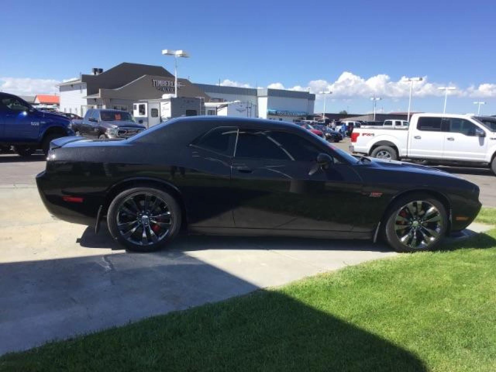 2014 Black Clearcoat /Radar Red/Dk Slate Gray Dodge Challenger SRT8 (2C3CDYCJ5EH) with an 6.4L V8 OHV 16V engine, 5-Speed Automatic transmission, located at 1235 N Woodruff Ave., Idaho Falls, 83401, (208) 523-1053, 43.507172, -112.000488 - SRT8, 392 Hemi, leather, automatic transmission,, heated seats, sunroof, multiple charge and USB ports, navigation, heated steering wheel, park assist, very low miles. At Timberline Auto it is always easy to find a great deal on your next vehicle! Our experienced sales staff can help find the right - Photo #5