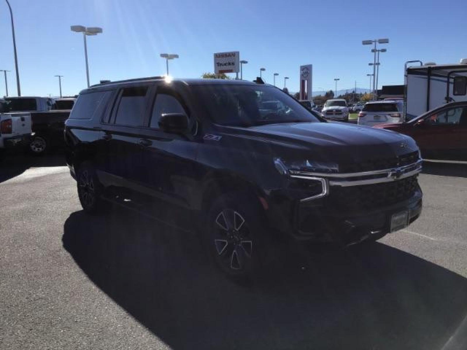 2022 Black /Jet Black Chevrolet Suburban Z71 (1GNSKDKDXNR) with an 5.3L V8 OHV 16V engine, 10-Speed Automatic transmission, located at 1235 N Woodruff Ave., Idaho Falls, 83401, (208) 523-1053, 43.507172, -112.000488 - This 2022 Chevrolet Suburban LT Z71, has the 5.3L V8 motor. It only has 35,683 miles. Comes with leather seats, both fronts seats are powered, heated seats, remote start, back up camera, lane assist, rear climate control, Bose stereo system, Running boards , and it has a towing package. At Timberlin - Photo #5