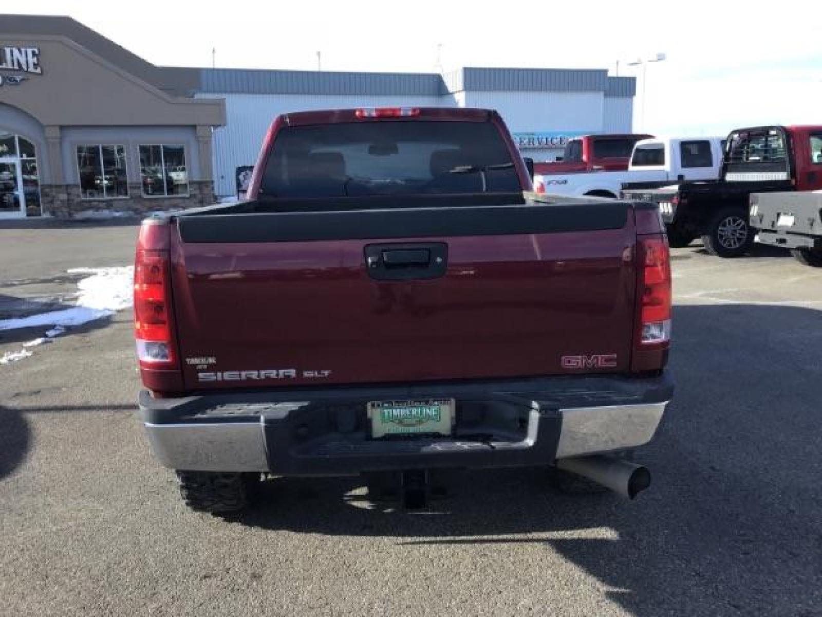 2013 Sonoma Red Metallic /Dark Titanium/Light Titanium Leather Interior GMC Sierra 2500HD SLT Crew Cab 4WD (1GT121C81DF) with an 6.6L V8 OHV 32V TURBO DIESEL engine, 6-Speed Automatic transmission, located at 1235 N Woodruff Ave., Idaho Falls, 83401, (208) 523-1053, 43.507172, -112.000488 - This 2013 GMC Sierra SLT 4x4, has the 6.6L duramax motor. It has 124,000 miles. Comes with leather interior, heated seats, blue tooth, dual power seats, key less remote, and turn over ball. At Timberline Auto it is always easy to find a great deal on your next vehicle! Our experienced sales staff ca - Photo #3