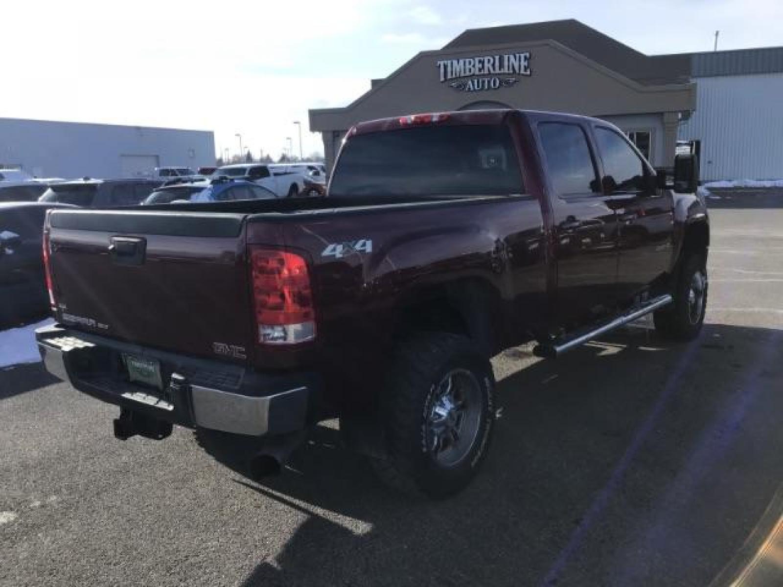 2013 Sonoma Red Metallic /Dark Titanium/Light Titanium Leather Interior GMC Sierra 2500HD SLT Crew Cab 4WD (1GT121C81DF) with an 6.6L V8 OHV 32V TURBO DIESEL engine, 6-Speed Automatic transmission, located at 1235 N Woodruff Ave., Idaho Falls, 83401, (208) 523-1053, 43.507172, -112.000488 - This 2013 GMC Sierra SLT 4x4, has the 6.6L duramax motor. It has 124,000 miles. Comes with leather interior, heated seats, blue tooth, dual power seats, key less remote, and turn over ball. At Timberline Auto it is always easy to find a great deal on your next vehicle! Our experienced sales staff ca - Photo #4