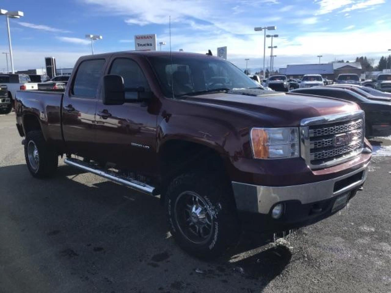 2013 Sonoma Red Metallic /Dark Titanium/Light Titanium Leather Interior GMC Sierra 2500HD SLT Crew Cab 4WD (1GT121C81DF) with an 6.6L V8 OHV 32V TURBO DIESEL engine, 6-Speed Automatic transmission, located at 1235 N Woodruff Ave., Idaho Falls, 83401, (208) 523-1053, 43.507172, -112.000488 - This 2013 GMC Sierra SLT 4x4, has the 6.6L duramax motor. It has 124,000 miles. Comes with leather interior, heated seats, blue tooth, dual power seats, key less remote, and turn over ball. At Timberline Auto it is always easy to find a great deal on your next vehicle! Our experienced sales staff ca - Photo #6