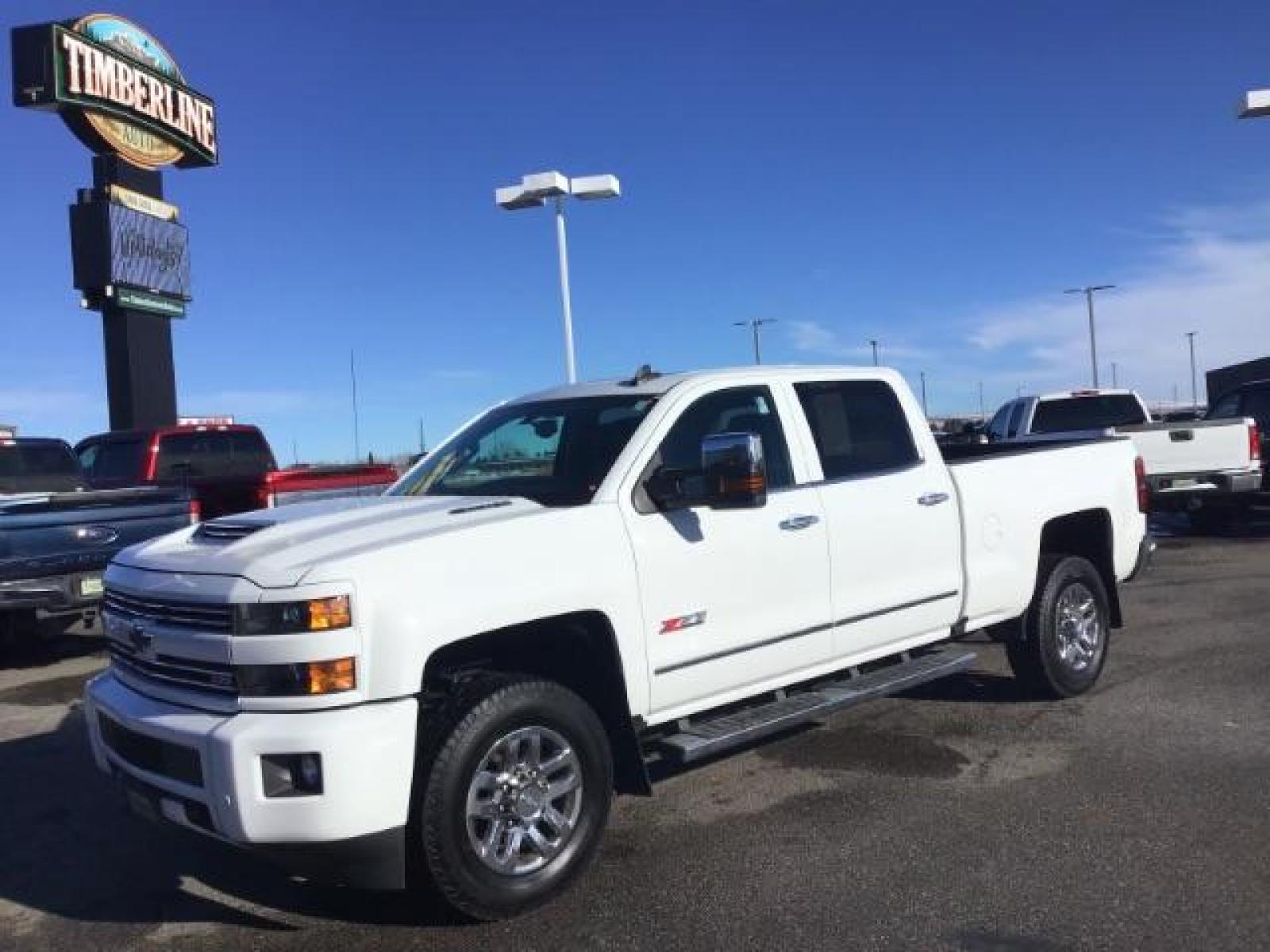 2017 Summit White /Jet Black, leather Chevrolet Silverado 3500HD LTZ Crew Cab 4WD (1GC4K0CY2HF) with an 6.6L V8 OHV 32V TURBO DIESEL engine, 6-Speed Automatic transmission, located at 1235 N Woodruff Ave., Idaho Falls, 83401, (208) 523-1053, 43.507172, -112.000488 - This 2017 Chevrolet 3500HD 4x4 Z71 LTZ, has the 6.6L diesel motor. It has 42,847 miles. It has leather interior, heated seats, sunroof, spray in bedliner, back up camera, also comes with a turnover ball. At Timberline Auto it is always easy to find a great deal on your next vehicle! Our experienced - Photo #0