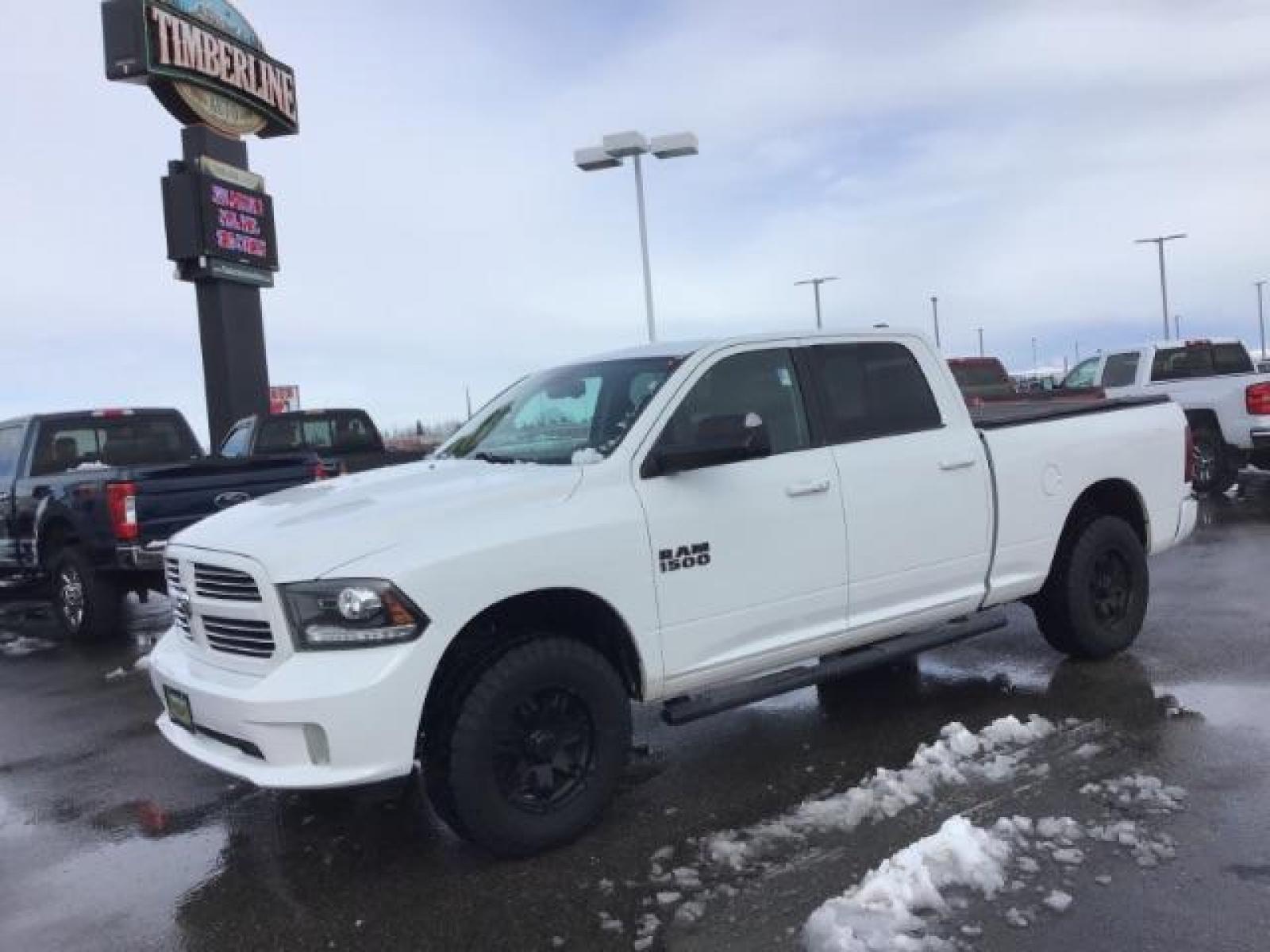 2014 Bright White Clearcoat /Black RAM 1500 Sport Crew Cab LWB 4WD (1C6RR7UT5ES) with an 5.7L V8 OHV 16V engine, 8-Speed Automatic transmission, located at 1235 N Woodruff Ave., Idaho Falls, 83401, (208) 523-1053, 43.507172, -112.000488 - This 2014 Ram 1500 Sport 4x4, has the 5.7L Hemi motor. It has 115,000 miles. Comes with leather interior, heated and cooled seats, power seats, blue tooth audio, back up camera, and power windows and locks. At Timberline Auto it is always easy to find a great deal on your next vehicle! Our experienc - Photo #0