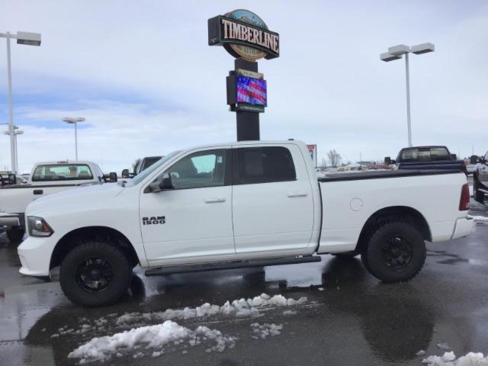 2014 Bright White Clearcoat /Black RAM 1500 Sport Crew Cab LWB 4WD (1C6RR7UT5ES) with an 5.7L V8 OHV 16V engine, 8-Speed Automatic transmission, located at 1235 N Woodruff Ave., Idaho Falls, 83401, (208) 523-1053, 43.507172, -112.000488 - Photo #1