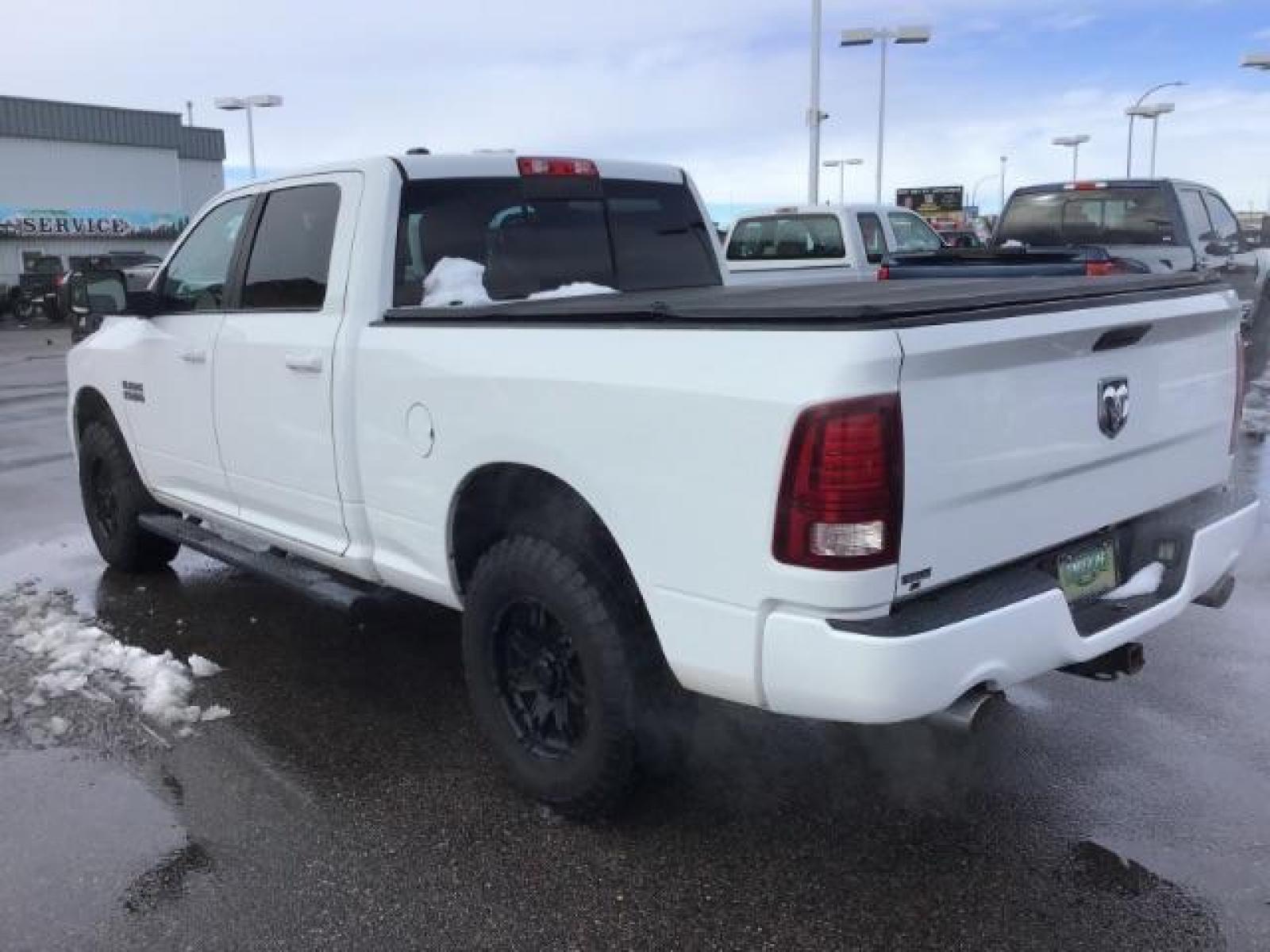 2014 Bright White Clearcoat /Black RAM 1500 Sport Crew Cab LWB 4WD (1C6RR7UT5ES) with an 5.7L V8 OHV 16V engine, 8-Speed Automatic transmission, located at 1235 N Woodruff Ave., Idaho Falls, 83401, (208) 523-1053, 43.507172, -112.000488 - This 2014 Ram 1500 Sport 4x4, has the 5.7L Hemi motor. It has 115,000 miles. Comes with leather interior, heated and cooled seats, power seats, blue tooth audio, back up camera, and power windows and locks. At Timberline Auto it is always easy to find a great deal on your next vehicle! Our experienc - Photo #2