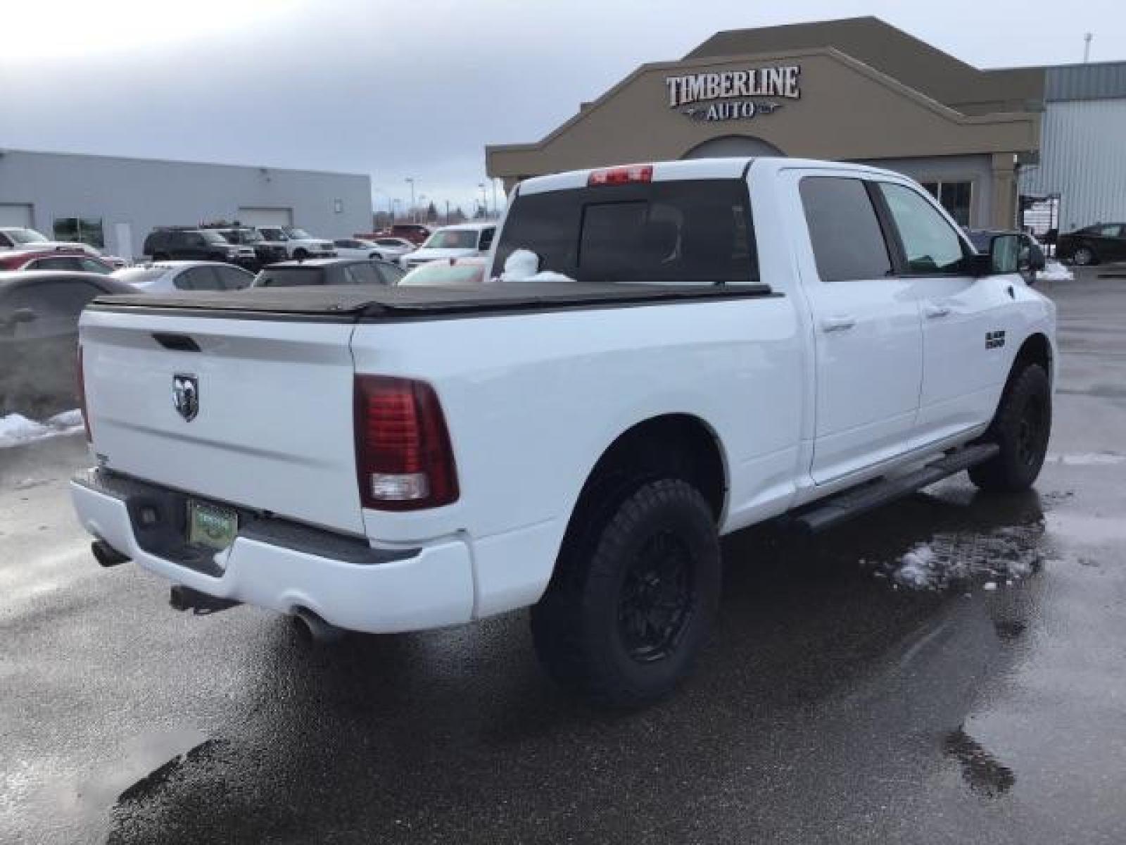 2014 Bright White Clearcoat /Black RAM 1500 Sport Crew Cab LWB 4WD (1C6RR7UT5ES) with an 5.7L V8 OHV 16V engine, 8-Speed Automatic transmission, located at 1235 N Woodruff Ave., Idaho Falls, 83401, (208) 523-1053, 43.507172, -112.000488 - Photo #4