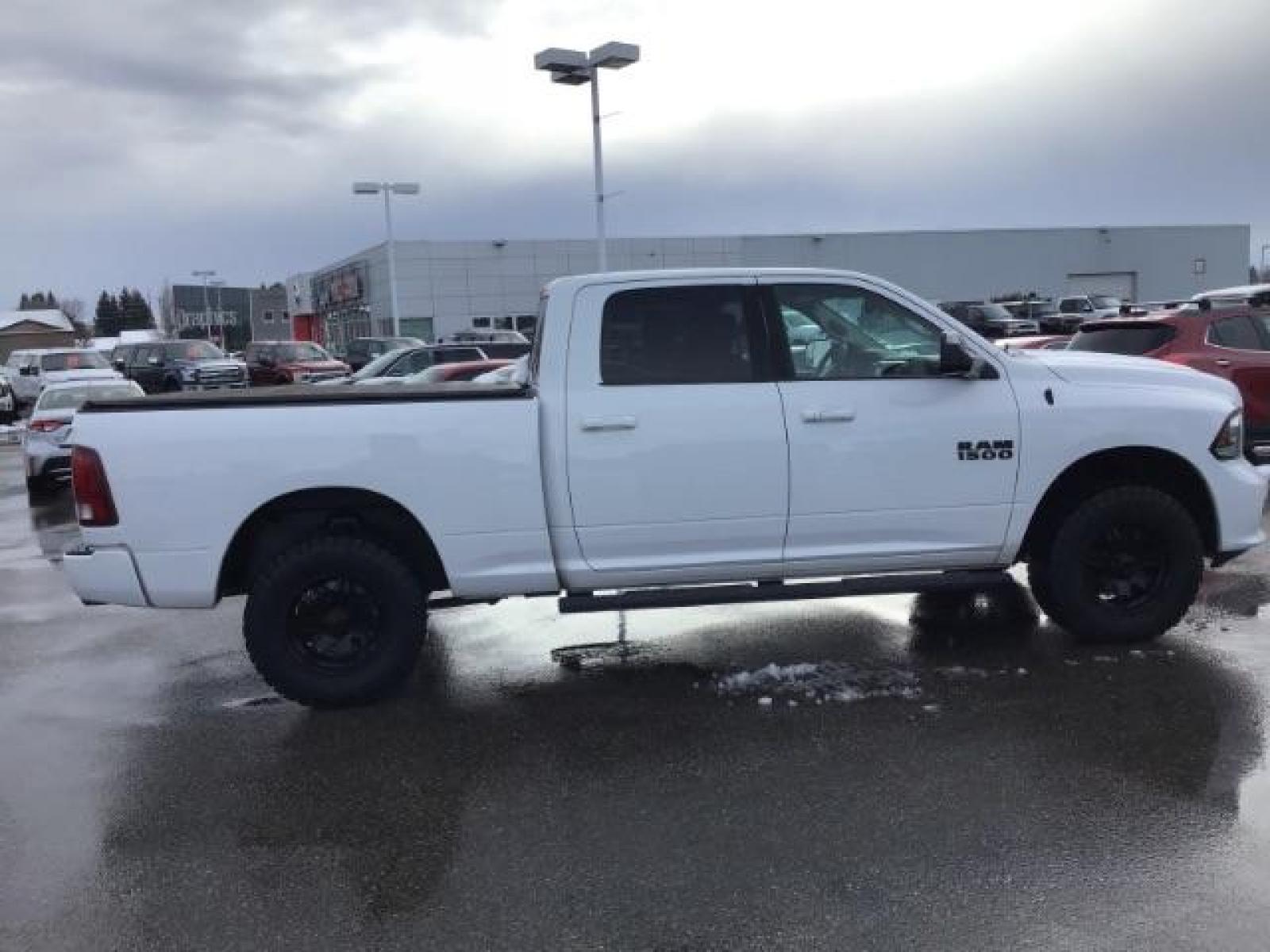 2014 Bright White Clearcoat /Black RAM 1500 Sport Crew Cab LWB 4WD (1C6RR7UT5ES) with an 5.7L V8 OHV 16V engine, 8-Speed Automatic transmission, located at 1235 N Woodruff Ave., Idaho Falls, 83401, (208) 523-1053, 43.507172, -112.000488 - This 2014 Ram 1500 Sport 4x4, has the 5.7L Hemi motor. It has 115,000 miles. Comes with leather interior, heated and cooled seats, power seats, blue tooth audio, back up camera, and power windows and locks. At Timberline Auto it is always easy to find a great deal on your next vehicle! Our experienc - Photo #5