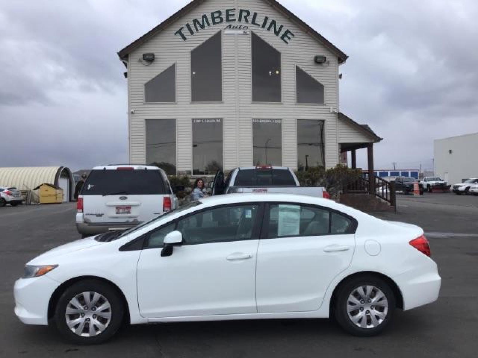 2012 Taffeta White /Gray Cloth Interior Honda Civic LX Sedan 5-Speed AT (19XFB2F54CE) with an 1.8L L4 SOHC 16V engine, 5-Speed Automatic transmission, located at 1235 N Woodruff Ave., Idaho Falls, 83401, (208) 523-1053, 43.507172, -112.000488 - This 2012 Honda Civic LX, has 98,000 miles. Comes with cloth interior, cruise control, power windows and locks, and AM/FM CD stereo. At Timberline Auto it is always easy to find a great deal on your next vehicle! Our experienced sales staff can help find the right vehicle will fit your needs. Our kn - Photo #1