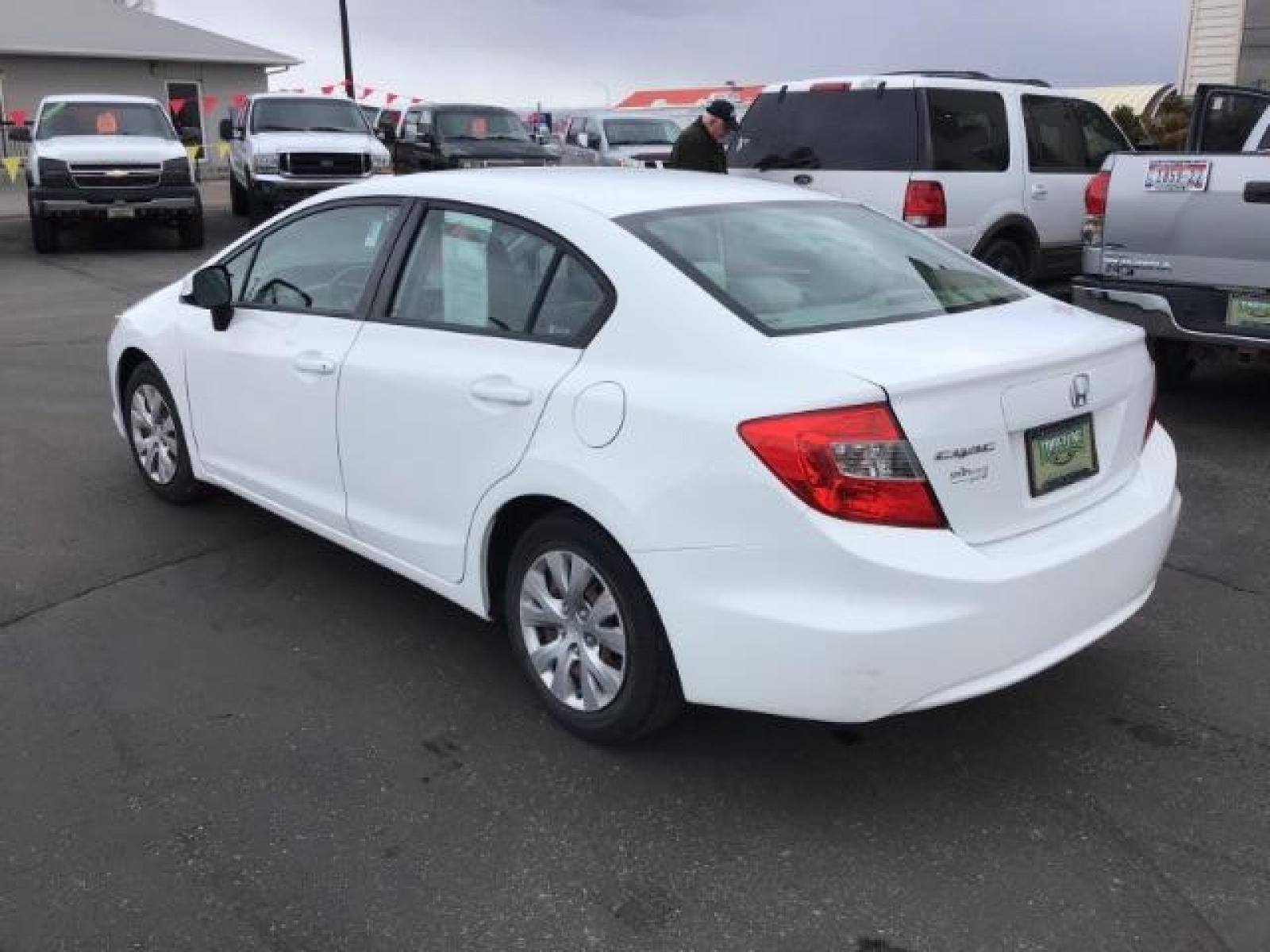 2012 Taffeta White /Gray Cloth Interior Honda Civic LX Sedan 5-Speed AT (19XFB2F54CE) with an 1.8L L4 SOHC 16V engine, 5-Speed Automatic transmission, located at 1235 N Woodruff Ave., Idaho Falls, 83401, (208) 523-1053, 43.507172, -112.000488 - This 2012 Honda Civic LX, has 98,000 miles. Comes with cloth interior, cruise control, power windows and locks, and AM/FM CD stereo. At Timberline Auto it is always easy to find a great deal on your next vehicle! Our experienced sales staff can help find the right vehicle will fit your needs. Our kn - Photo #2