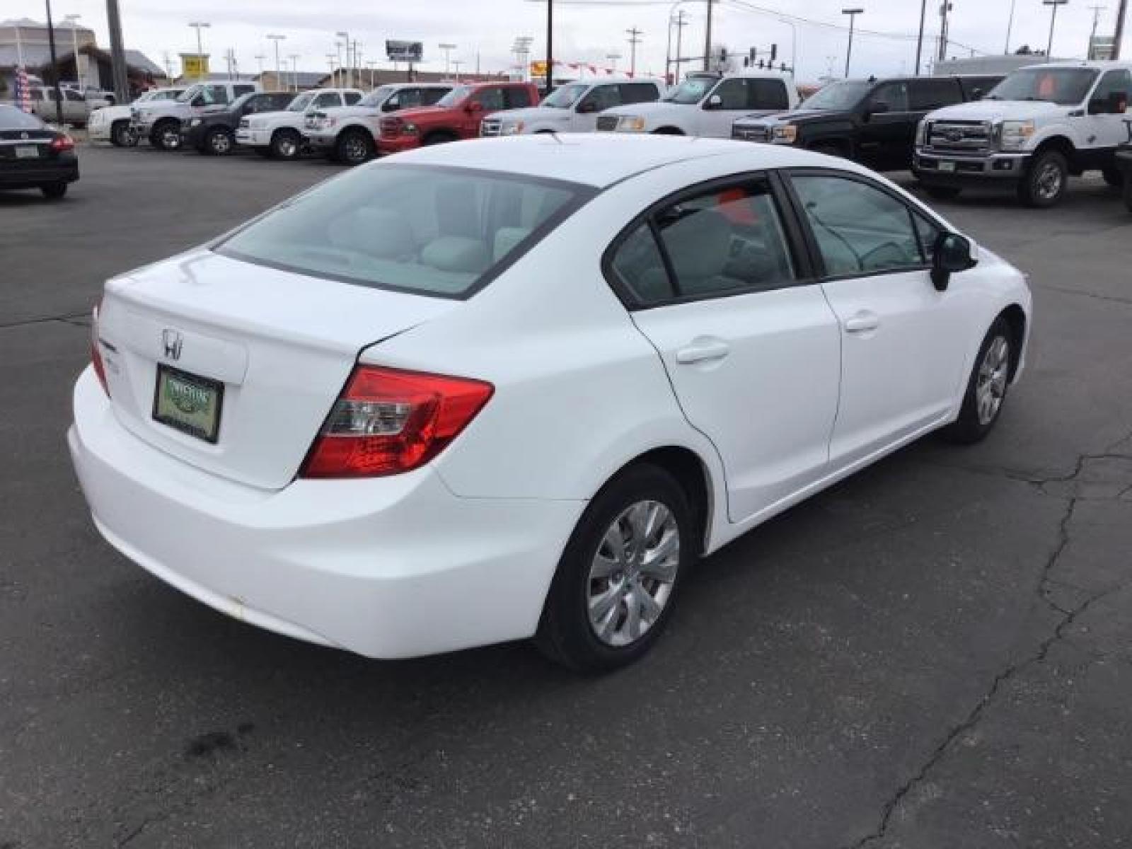 2012 Taffeta White /Gray Cloth Interior Honda Civic LX Sedan 5-Speed AT (19XFB2F54CE) with an 1.8L L4 SOHC 16V engine, 5-Speed Automatic transmission, located at 1235 N Woodruff Ave., Idaho Falls, 83401, (208) 523-1053, 43.507172, -112.000488 - This 2012 Honda Civic LX, has 98,000 miles. Comes with cloth interior, cruise control, power windows and locks, and AM/FM CD stereo. At Timberline Auto it is always easy to find a great deal on your next vehicle! Our experienced sales staff can help find the right vehicle will fit your needs. Our kn - Photo #4