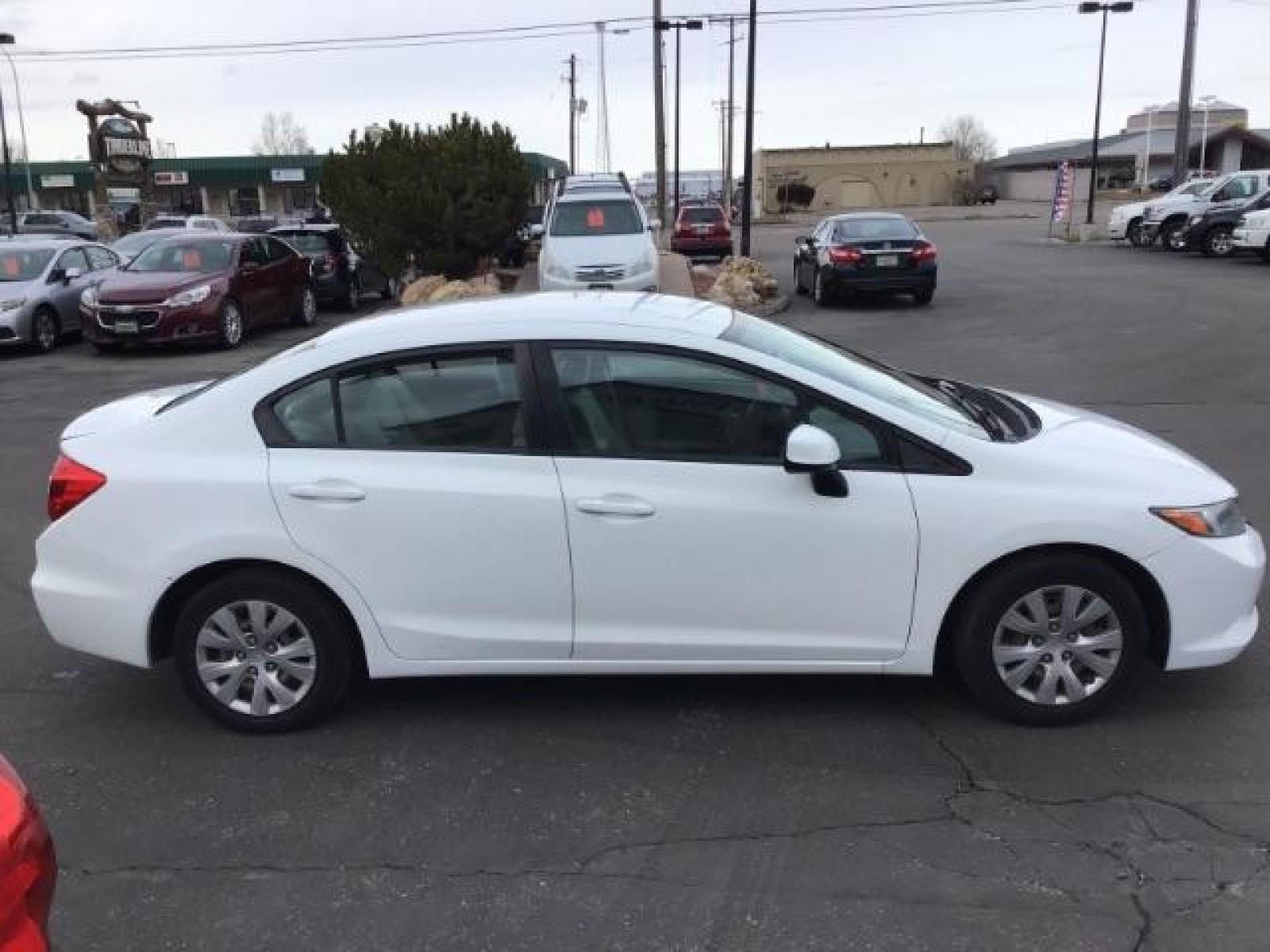 2012 Taffeta White /Gray Cloth Interior Honda Civic LX Sedan 5-Speed AT (19XFB2F54CE) with an 1.8L L4 SOHC 16V engine, 5-Speed Automatic transmission, located at 1235 N Woodruff Ave., Idaho Falls, 83401, (208) 523-1053, 43.507172, -112.000488 - This 2012 Honda Civic LX, has 98,000 miles. Comes with cloth interior, cruise control, power windows and locks, and AM/FM CD stereo. At Timberline Auto it is always easy to find a great deal on your next vehicle! Our experienced sales staff can help find the right vehicle will fit your needs. Our kn - Photo #5
