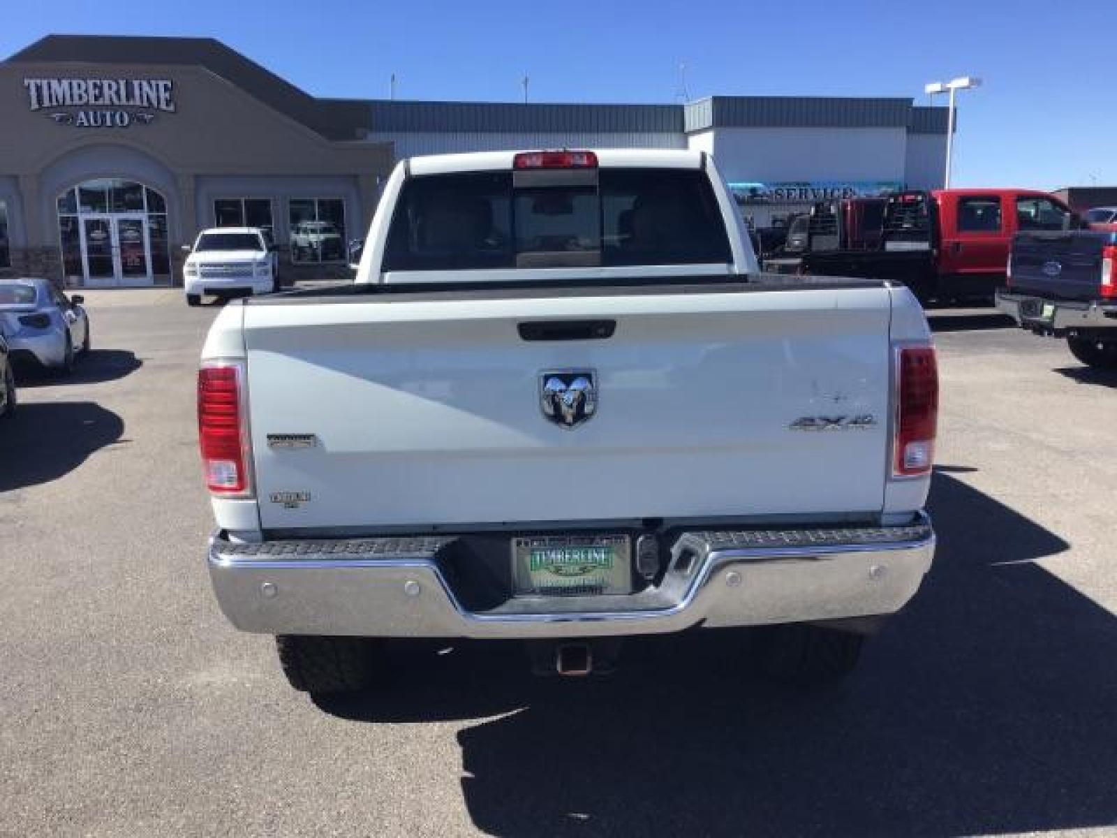 2017 WHITE /Black, leather RAM 3500 Laramie Crew Cab SWB 4WD (3C63R3EL0HG) with an 6.7L L6 OHV 24V TURBO DIESEL engine, 6-Speed Automatic transmission, located at 1235 N Woodruff Ave., Idaho Falls, 83401, (208) 523-1053, 43.507172, -112.000488 - This 2017 Ram 3500 Laramie 4x4, has the 6.7L cummins motor. It has 116,000 miles. Comes with leather interior, heated and cooled seats, dual power seats, navigation, back up camera, spray in bedliner, and blue tooth audio. At Timberline Auto it is always easy to find a great deal on your next vehicl - Photo #3