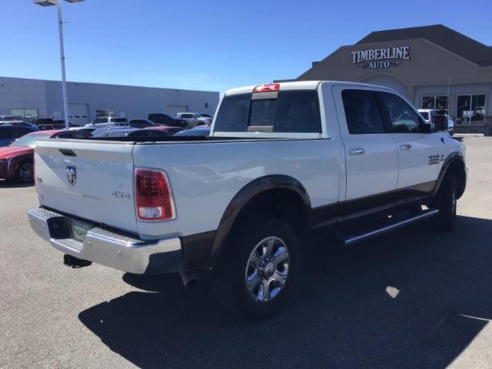 2017 WHITE /Black, leather RAM 3500 Laramie Crew Cab SWB 4WD (3C63R3EL0HG) with an 6.7L L6 OHV 24V TURBO DIESEL engine, 6-Speed Automatic transmission, located at 1235 N Woodruff Ave., Idaho Falls, 83401, (208) 523-1053, 43.507172, -112.000488 - This 2017 Ram 3500 Laramie 4x4, has the 6.7L cummins motor. It has 116,000 miles. Comes with leather interior, heated and cooled seats, dual power seats, navigation, back up camera, spray in bedliner, and blue tooth audio. At Timberline Auto it is always easy to find a great deal on your next vehicl - Photo #4