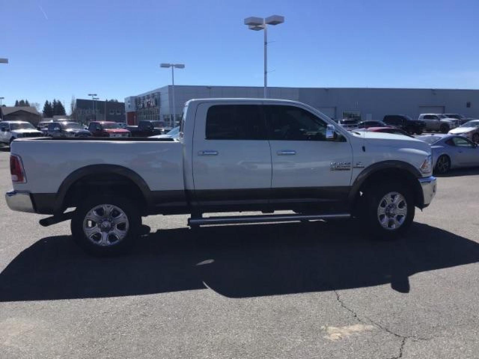 2017 WHITE /Black, leather RAM 3500 Laramie Crew Cab SWB 4WD (3C63R3EL0HG) with an 6.7L L6 OHV 24V TURBO DIESEL engine, 6-Speed Automatic transmission, located at 1235 N Woodruff Ave., Idaho Falls, 83401, (208) 523-1053, 43.507172, -112.000488 - This 2017 Ram 3500 Laramie 4x4, has the 6.7L cummins motor. It has 116,000 miles. Comes with leather interior, heated and cooled seats, dual power seats, navigation, back up camera, spray in bedliner, and blue tooth audio. At Timberline Auto it is always easy to find a great deal on your next vehicl - Photo #5