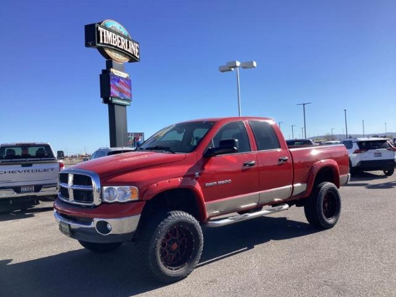 2004 Flame Red /Dark Slate Gray Leather Interior Dodge Ram 2500 SLT Quad Cab 4WD (3D7KU28CX4G) with an 5.9L L6 OHV 24V TURBO DIESEL engine, 5-Speed Automatic transmission, located at 1235 N Woodruff Ave., Idaho Falls, 83401, (208) 523-1053, 43.507172, -112.000488 - The 2004 Dodge Ram 2500 Quad Cab SLT Diesel is a robust and capable truck known for its towing capacity and durability. Here are some of the key features you might find on this model: Engine: Equipped with a powerful and torquey Cummins 5.9-liter inline-six turbocharged diesel engine, known for its - Photo #0