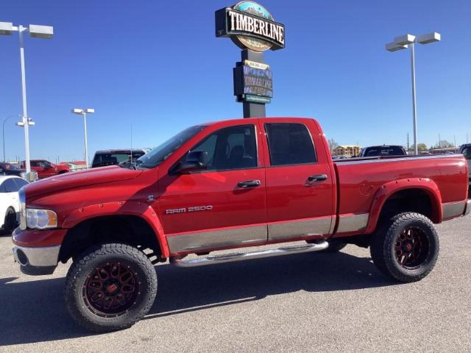 2004 Flame Red /Dark Slate Gray Leather Interior Dodge Ram 2500 SLT Quad Cab 4WD (3D7KU28CX4G) with an 5.9L L6 OHV 24V TURBO DIESEL engine, 5-Speed Automatic transmission, located at 1235 N Woodruff Ave., Idaho Falls, 83401, (208) 523-1053, 43.507172, -112.000488 - The 2004 Dodge Ram 2500 Quad Cab SLT Diesel is a robust and capable truck known for its towing capacity and durability. Here are some of the key features you might find on this model: Engine: Equipped with a powerful and torquey Cummins 5.9-liter inline-six turbocharged diesel engine, known for its - Photo #1