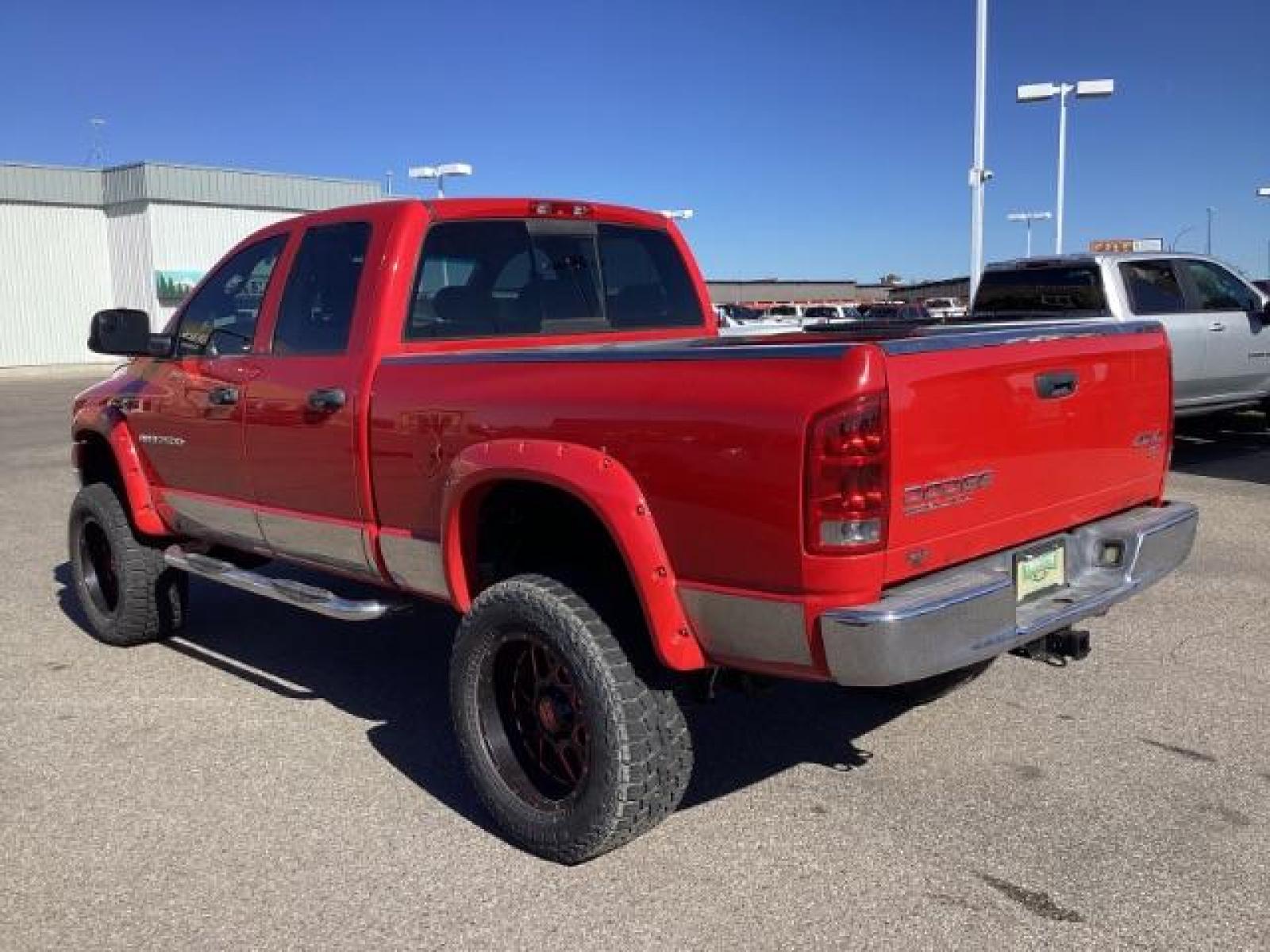 2004 Flame Red /Dark Slate Gray Leather Interior Dodge Ram 2500 SLT Quad Cab 4WD (3D7KU28CX4G) with an 5.9L L6 OHV 24V TURBO DIESEL engine, 5-Speed Automatic transmission, located at 1235 N Woodruff Ave., Idaho Falls, 83401, (208) 523-1053, 43.507172, -112.000488 - The 2004 Dodge Ram 2500 Quad Cab SLT Diesel is a robust and capable truck known for its towing capacity and durability. Here are some of the key features you might find on this model: Engine: Equipped with a powerful and torquey Cummins 5.9-liter inline-six turbocharged diesel engine, known for its - Photo #2