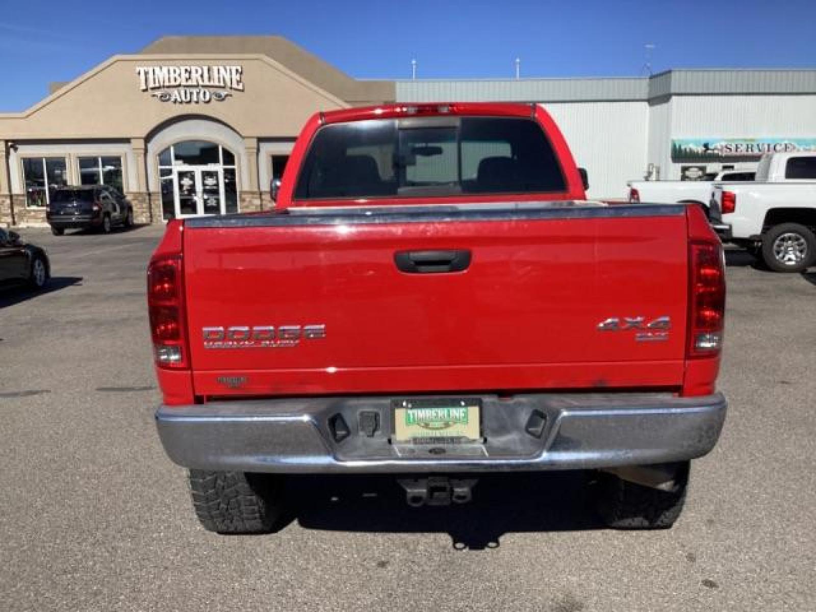 2004 Flame Red /Dark Slate Gray Leather Interior Dodge Ram 2500 SLT Quad Cab 4WD (3D7KU28CX4G) with an 5.9L L6 OHV 24V TURBO DIESEL engine, 5-Speed Automatic transmission, located at 1235 N Woodruff Ave., Idaho Falls, 83401, (208) 523-1053, 43.507172, -112.000488 - The 2004 Dodge Ram 2500 Quad Cab SLT Diesel is a robust and capable truck known for its towing capacity and durability. Here are some of the key features you might find on this model: Engine: Equipped with a powerful and torquey Cummins 5.9-liter inline-six turbocharged diesel engine, known for its - Photo #3