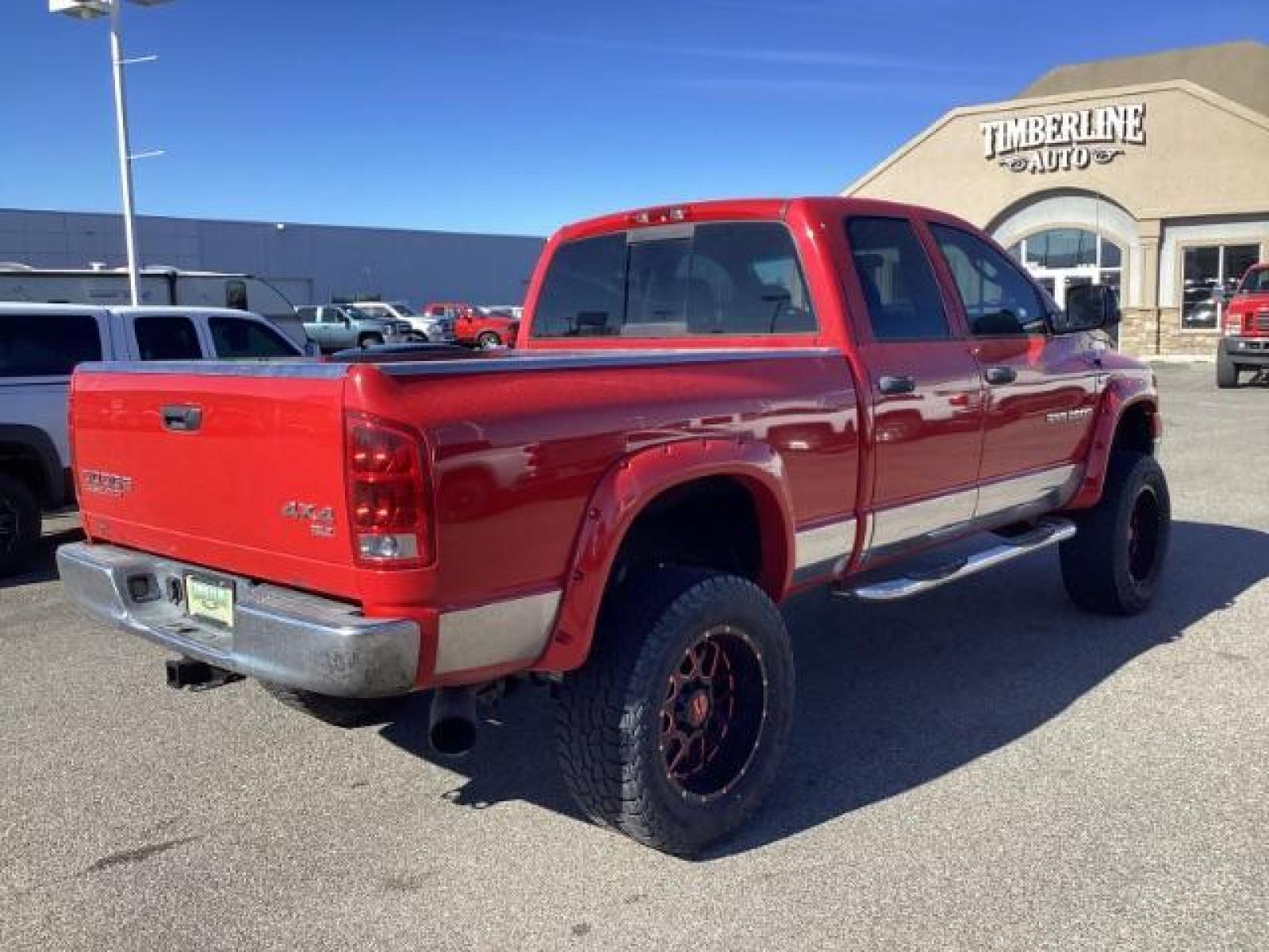 2004 Flame Red /Dark Slate Gray Leather Interior Dodge Ram 2500 SLT Quad Cab 4WD (3D7KU28CX4G) with an 5.9L L6 OHV 24V TURBO DIESEL engine, 5-Speed Automatic transmission, located at 1235 N Woodruff Ave., Idaho Falls, 83401, (208) 523-1053, 43.507172, -112.000488 - The 2004 Dodge Ram 2500 Quad Cab SLT Diesel is a robust and capable truck known for its towing capacity and durability. Here are some of the key features you might find on this model: Engine: Equipped with a powerful and torquey Cummins 5.9-liter inline-six turbocharged diesel engine, known for its - Photo #4