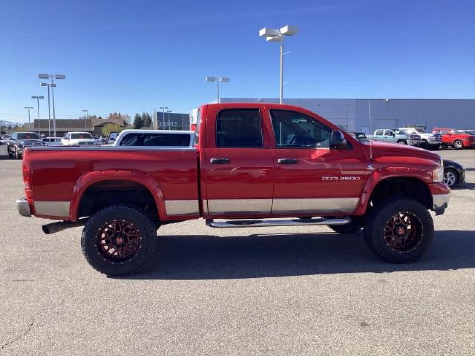 2004 Flame Red /Dark Slate Gray Leather Interior Dodge Ram 2500 SLT Quad Cab 4WD (3D7KU28CX4G) with an 5.9L L6 OHV 24V TURBO DIESEL engine, 5-Speed Automatic transmission, located at 1235 N Woodruff Ave., Idaho Falls, 83401, (208) 523-1053, 43.507172, -112.000488 - The 2004 Dodge Ram 2500 Quad Cab SLT Diesel is a robust and capable truck known for its towing capacity and durability. Here are some of the key features you might find on this model: Engine: Equipped with a powerful and torquey Cummins 5.9-liter inline-six turbocharged diesel engine, known for its - Photo #5