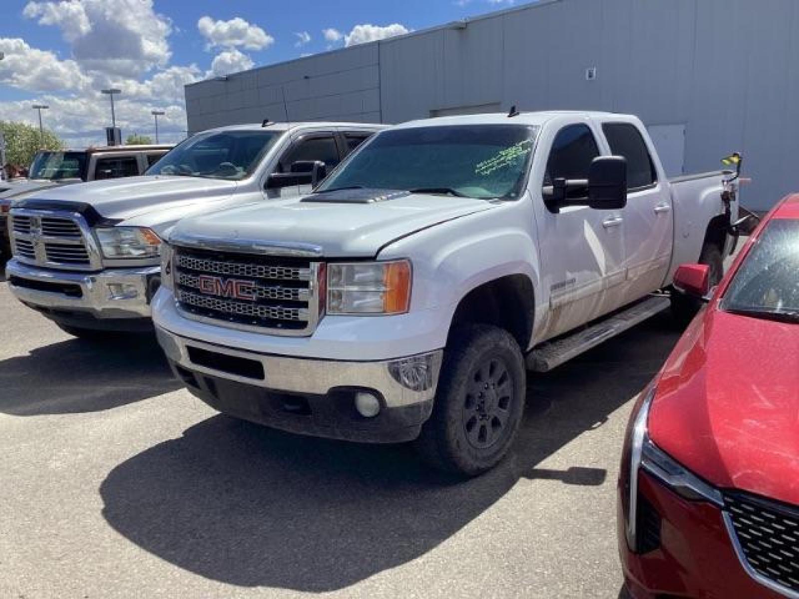 2013 Summit White /Ebony Leather Interior GMC Sierra 2500HD SLT Crew Cab 4WD (1GT121E86DF) with an 6.6L V8 OHV 32V TURBO DIESEL engine, 6-Speed Automatic transmission, located at 1235 N Woodruff Ave., Idaho Falls, 83401, (208) 523-1053, 43.507172, -112.000488 - New Inventory. Going thru service and inspection. Call for more pictures. At Timberline Auto it is always easy to find a great deal on your next vehicle! Our experienced sales staff can help find the right vehicle that will fit your needs. Our knowledgeable finance department has options for almost - Photo #0