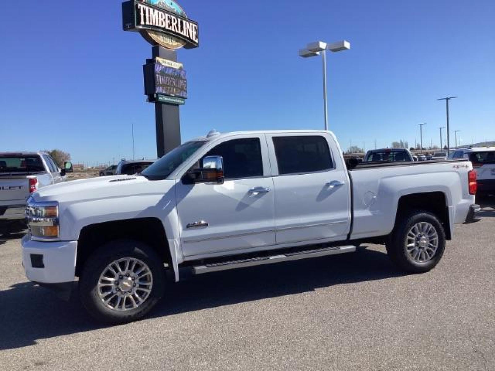 2015 Summit White /Jet Black Chevrolet Silverado 2500HD LT Crew Cab 4WD (1GC1KXE81FF) with an 6.6L V8 OHV 32V TURBO DIESEL engine, 6-Speed Automatic transmission, located at 1235 N Woodruff Ave., Idaho Falls, 83401, (208) 523-1053, 43.507172, -112.000488 - The 2015 Chevrolet Silverado 2500HD High Country Diesel is a top-of-the-line trim level of the Silverado heavy-duty pickup truck, offering a blend of luxury, capability, and advanced technology. Here are some key features you might find on the 2015 Chevrolet Silverado 2500HD High Country Diesel: Dur - Photo #1