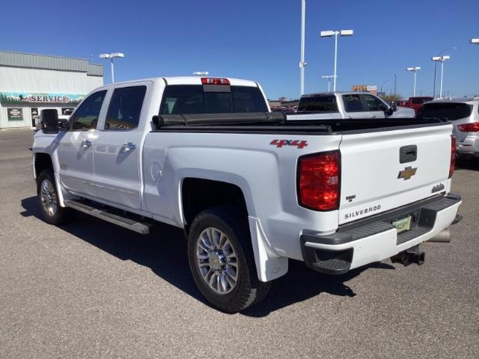2015 Summit White /Jet Black Chevrolet Silverado 2500HD LT Crew Cab 4WD (1GC1KXE81FF) with an 6.6L V8 OHV 32V TURBO DIESEL engine, 6-Speed Automatic transmission, located at 1235 N Woodruff Ave., Idaho Falls, 83401, (208) 523-1053, 43.507172, -112.000488 - The 2015 Chevrolet Silverado 2500HD High Country Diesel is a top-of-the-line trim level of the Silverado heavy-duty pickup truck, offering a blend of luxury, capability, and advanced technology. Here are some key features you might find on the 2015 Chevrolet Silverado 2500HD High Country Diesel: Dur - Photo #2