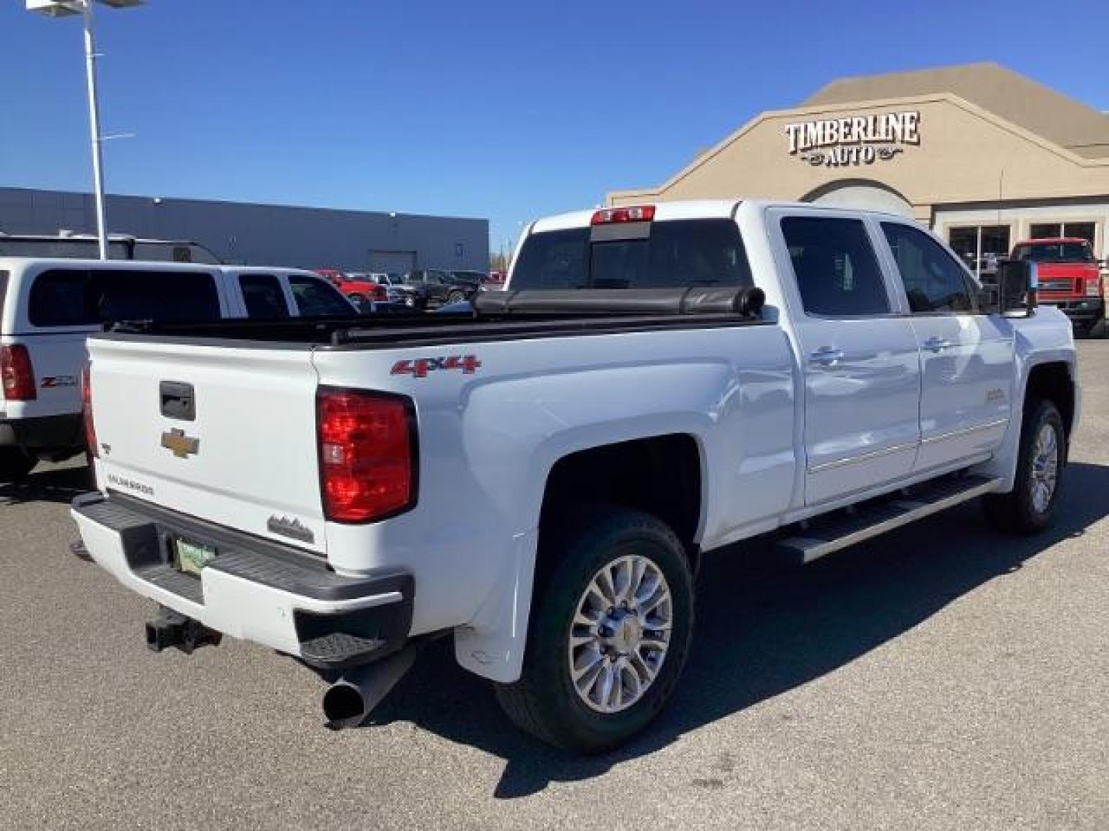 2015 Summit White /Jet Black Chevrolet Silverado 2500HD LT Crew Cab 4WD (1GC1KXE81FF) with an 6.6L V8 OHV 32V TURBO DIESEL engine, 6-Speed Automatic transmission, located at 1235 N Woodruff Ave., Idaho Falls, 83401, (208) 523-1053, 43.507172, -112.000488 - The 2015 Chevrolet Silverado 2500HD High Country Diesel is a top-of-the-line trim level of the Silverado heavy-duty pickup truck, offering a blend of luxury, capability, and advanced technology. Here are some key features you might find on the 2015 Chevrolet Silverado 2500HD High Country Diesel: Dur - Photo #4
