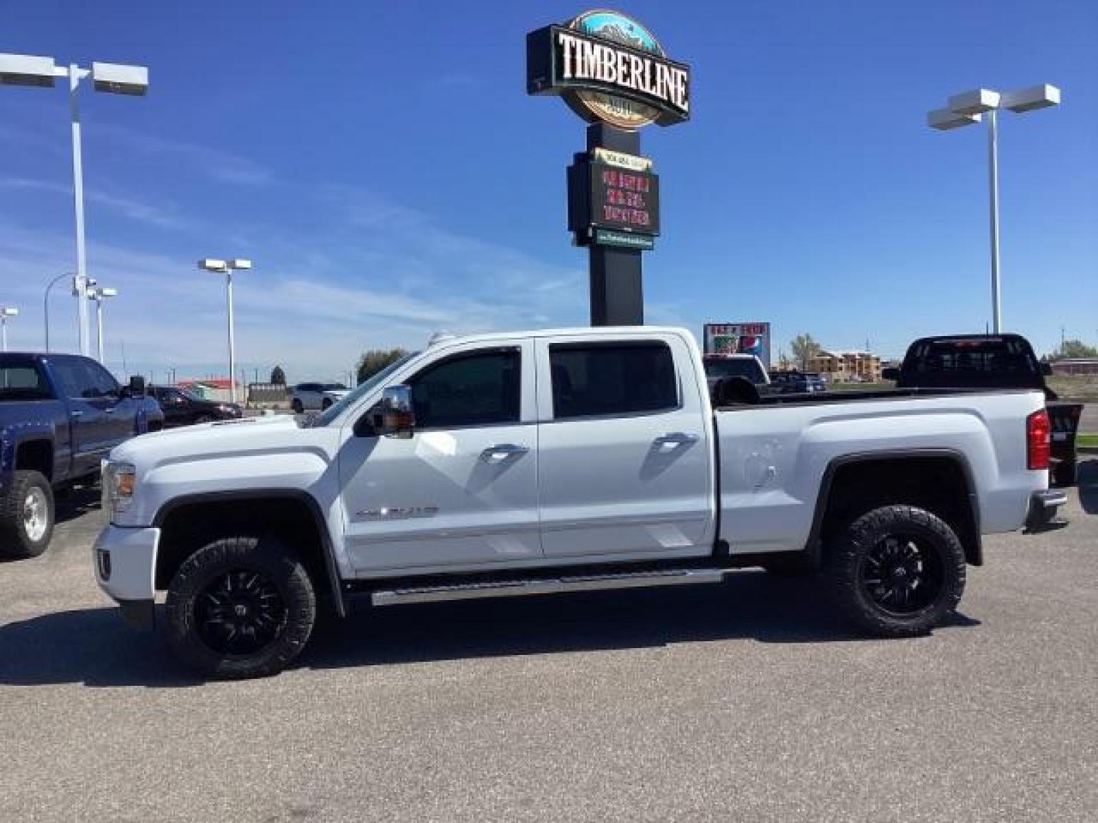 2016 Summit White /Cocoa/Dune, leather GMC Sierra 2500HD Denali Crew Cab 4WD (1GT12UE83GF) with an 6.6L V8 OHV 16 DIESEL engine, 6-Speed Automatic transmission, located at 1235 N Woodruff Ave., Idaho Falls, 83401, (208) 523-1053, 43.507172, -112.000488 - The 2016 GMC Sierra Denali 6.6L typically offers a combination of power, luxury, and capability. Here are some of the key features you can expect to find in this model: Engine: The 6.6-liter V8 turbo diesel engine is one of the standout features of the Sierra Denali. This engine delivers robust per - Photo #1