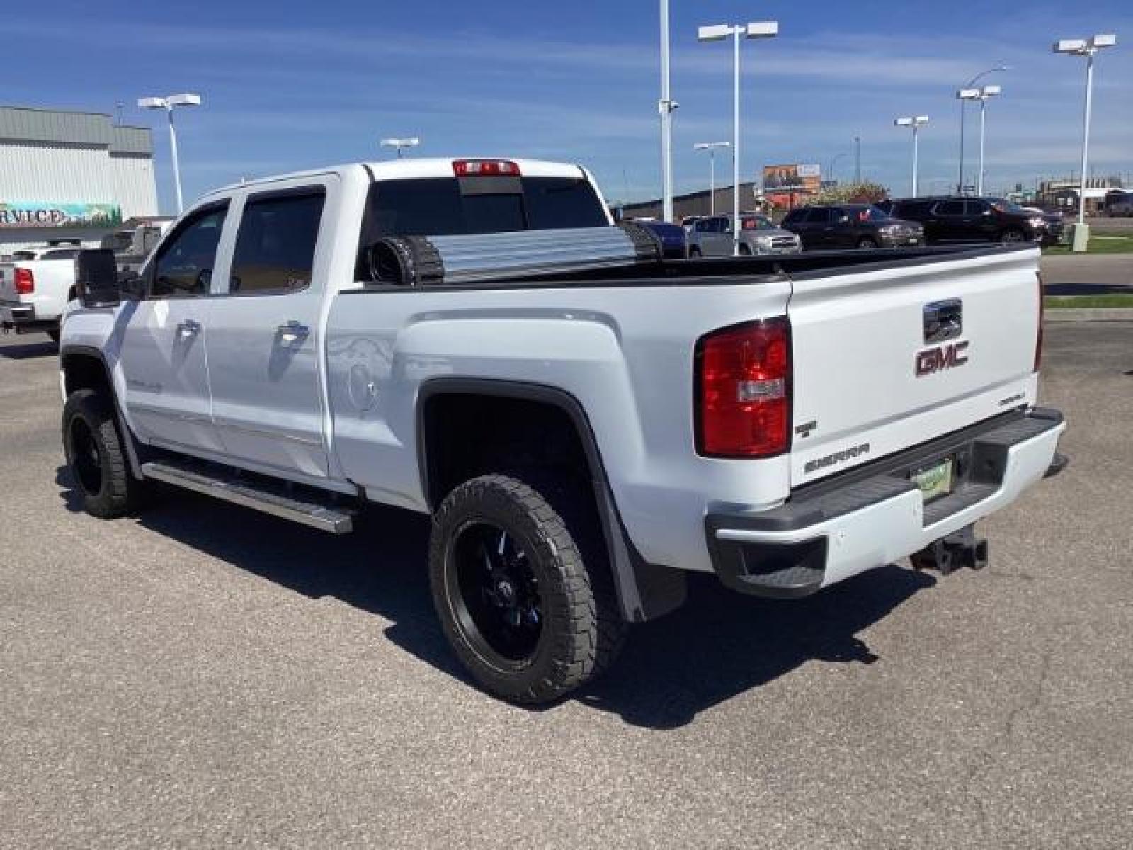 2016 Summit White /Cocoa/Dune, leather GMC Sierra 2500HD Denali Crew Cab 4WD (1GT12UE83GF) with an 6.6L V8 OHV 16 DIESEL engine, 6-Speed Automatic transmission, located at 1235 N Woodruff Ave., Idaho Falls, 83401, (208) 523-1053, 43.507172, -112.000488 - The 2016 GMC Sierra Denali 6.6L typically offers a combination of power, luxury, and capability. Here are some of the key features you can expect to find in this model: Engine: The 6.6-liter V8 turbo diesel engine is one of the standout features of the Sierra Denali. This engine delivers robust per - Photo #2